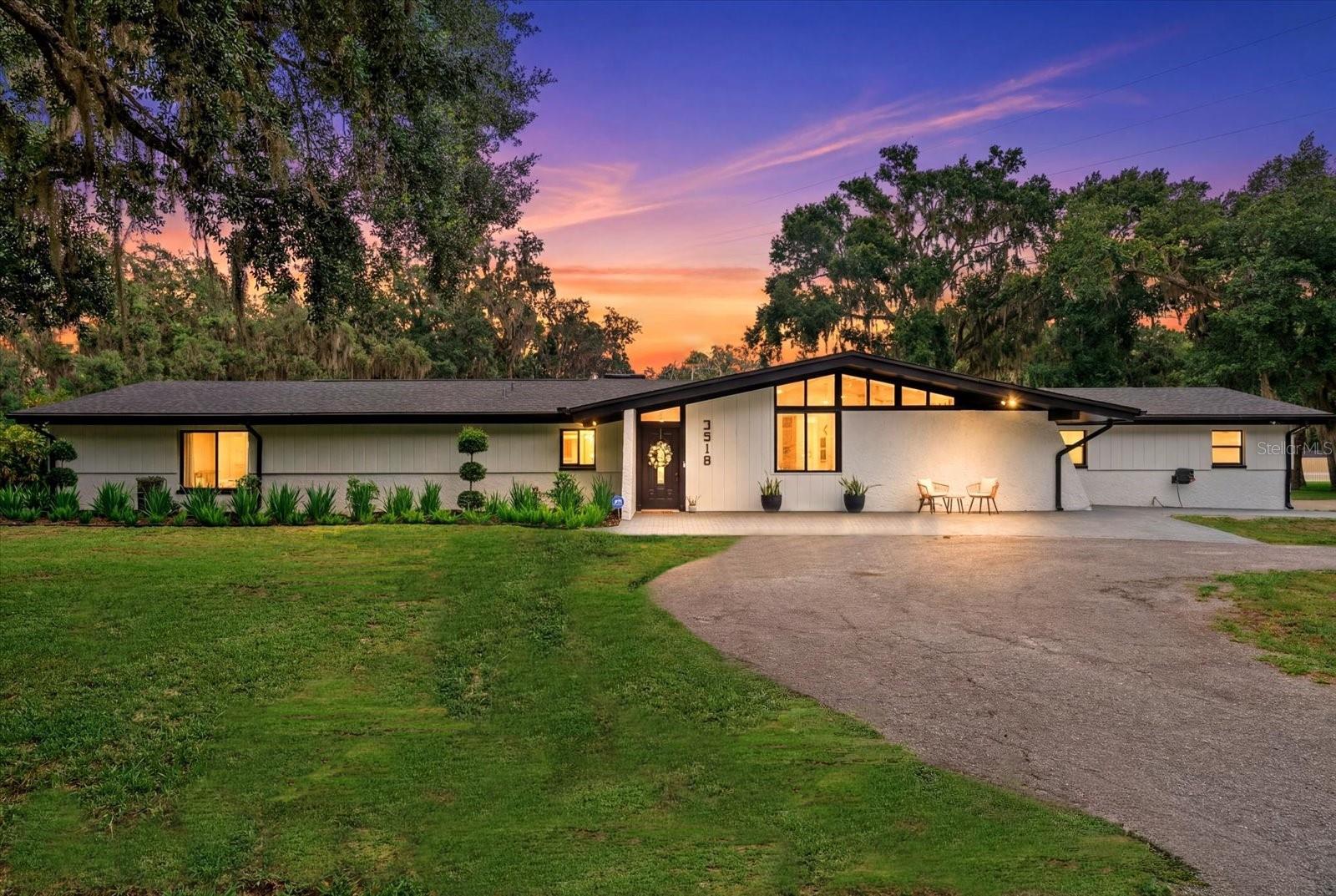Virtually Staged. BUYERS, BUYERS, BUYERS, DON'T MISS OUT!!!  Prime Tampa acreage living in the highly desirable Crenshaw Lakes area! Nestled on 2.23 picturesque acres with beautiful mature oak trees, this exceptional property offers a rare estate-style acreage lifestyle with the perfect combination of privacy, space, and convenience — all with NO HOA and NO CDD fees.

Located in the heart of Tampa, this beautifully updated 3-bedroom, 2-bathroom, 2-car garage residence features 2,376 square feet of living space with an inviting open floor plan designed for both everyday comfort and entertaining.

The spacious primary suite offers a generously sized ensuite bathroom and walk-in closet, creating a comfortable private retreat within the home.

A long circular driveway welcomes guests with abundant parking and creates an impressive arrival experience while providing ample space for family gatherings, recreational vehicles, boats, and additional storage needs.

Inside, the home has been thoughtfully renovated with upscale finishes including stunning quartzite countertops, upgraded appliances, luxury vinyl flooring, porcelain tile bathroom finishes, an updated fireplace, and fresh interior and exterior paint. Major system improvements provide peace of mind with a NEW 2024 roof, TWO NEW 2024 HVAC systems, and a 2024 tankless water heater.

Step outside and enjoy the freedom this oversized parcel provides with room for RV and boat parking, two detached storage sheds, newly enhanced landscaping, and outdoor living opportunities rarely found this close to Tampa conveniences.

This prime central Tampa location offers the increasingly rare opportunity to enjoy estate-style acreage living while remaining conveniently positioned near shopping, dining, major roadways, and everyday conveniences.