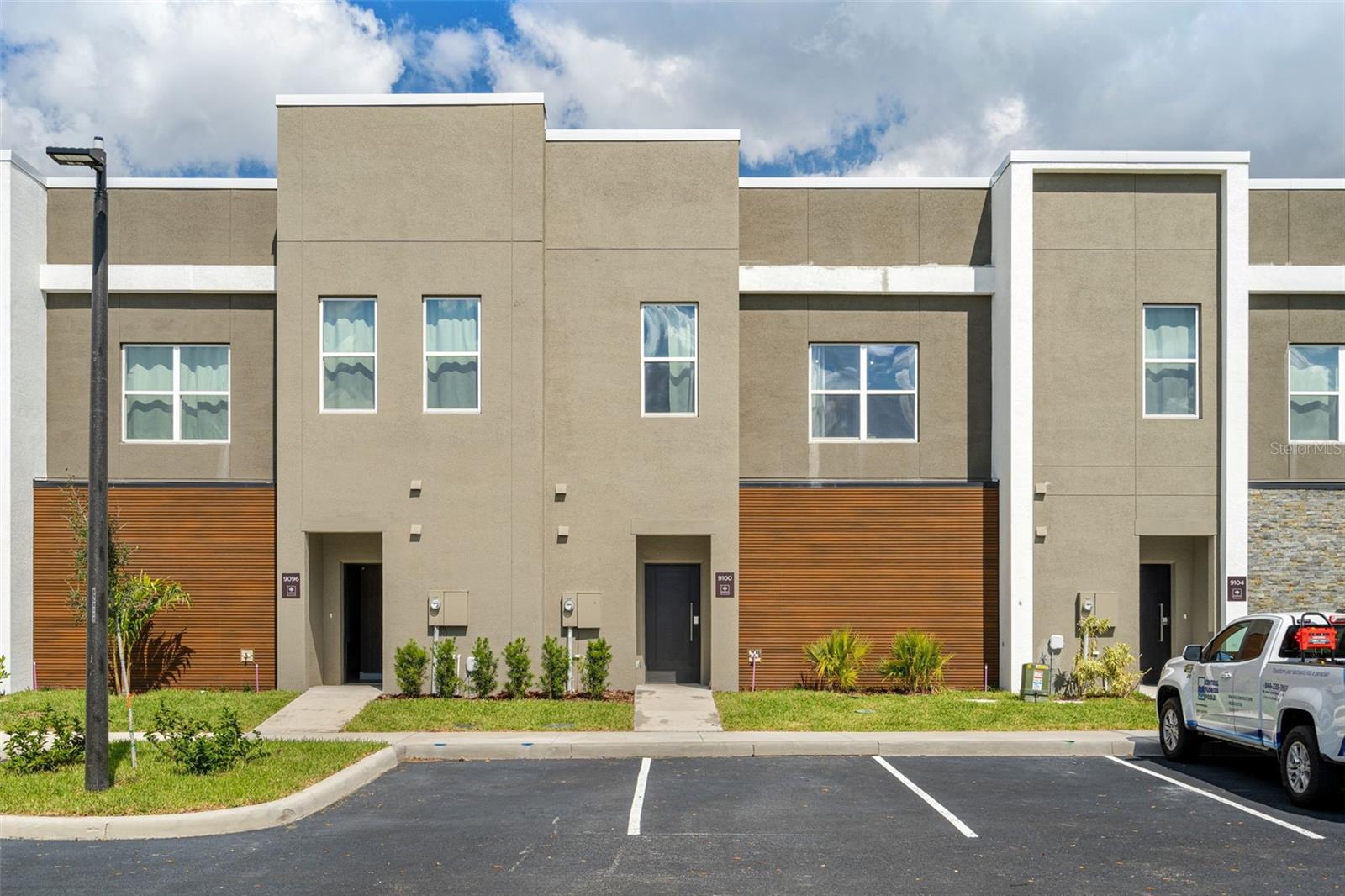 Experience luxury, style, and exceptional investment potential in this fully upgraded 5-bedroom, 4.5-bathroom townhome located in the exclusive Doppio Westside Resort, one of Central Florida’s newest premier short-term rental communities. Just 15 minutes from Walt Disney World, this contemporary residence was thoughtfully designed to maximize both guest experience and owner returns.

From the moment you enter, you’ll appreciate the spacious open-concept design featuring expansive living and dining areas that seamlessly connect to the private heated pool, creating the perfect indoor-outdoor entertainment space.

The chef-inspired kitchen is a true centerpiece, showcasing two oversized islands, Level 5 quartz countertops, a designer backsplash, elegant slatted wood accents, Whirlpool stainless steel appliances, and premium soft-close cabinetry with sleek matte hardware throughout.

Designed with flexibility and comfort in mind, the home offers five spacious bedrooms, including four luxurious en-suite bedrooms and a convenient first-floor bedroom, making it ideal for large families and vacation groups. Every bathroom features designer porcelain tile, frameless glass shower enclosures, built-in niches, and stylish vessel sinks in select bathrooms.

Luxury Vinyl Plank flooring extends throughout the entire home with absolutely no carpet, while oversized 5.5-inch square baseboards add a luxury custom finish. Additional premium features include PVC impact-resistant windows, smart front door lock, owner’s lockable storage closet, hybrid water heater, smart thermostat, and two dedicated parking spaces.

Built for long-term durability and efficiency, the home features full concrete block construction on both the first and second floors, an insulated sandwich roof system, and a rubber membrane roofing system designed for superior performance and energy efficiency.

Located within a gated resort community, Doppio Westside offers an impressive collection of resort-style amenities including a spectacular lagoon-style swimming pool, full-service restaurant, elegant clubhouse with concierge services, state-of-the-art fitness center, playground, convention and event center, and electric vehicle charging stations. Best of all, the community is fully approved and exclusively zoned for short-term rentals, offering investors outstanding flexibility and rental income potential.

Whether you’re searching for a high-performing vacation rental, a second home, or a smart addition to your investment portfolio, this exceptional property delivers luxury, quality construction, and an unbeatable location in the heart of Central Florida