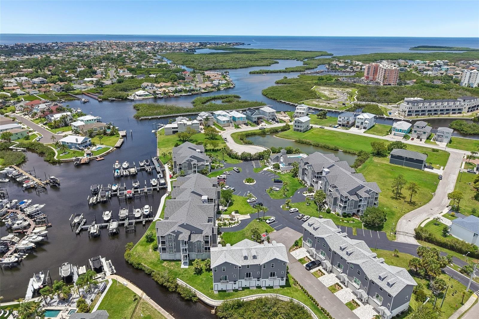 Welcome to waterfront living in the highly desirable Mariners Way at Gulf Harbors! This beautifully maintained 2-bedroom, 2-bath condominium offers the perfect blend of coastal lifestyle, comfort, and convenience.
Enjoy water views from your screened balcony and the rare opportunity to own your own private boat slip with direct Gulf access. Whether you're an avid boater, fisherman, or simply enjoy spectacular Florida sunsets, this property delivers the waterfront lifestyle you've been dreaming about. The bright, open floor plan features an updated kitchen with granite countertops, modern cabinetry, newer appliances, and a spacious living and dining area designed for easy entertaining. The primary suite offers a walk-in closet, private bath, and its own screened balcony retreat. slip included. Schedule your showing today!**
