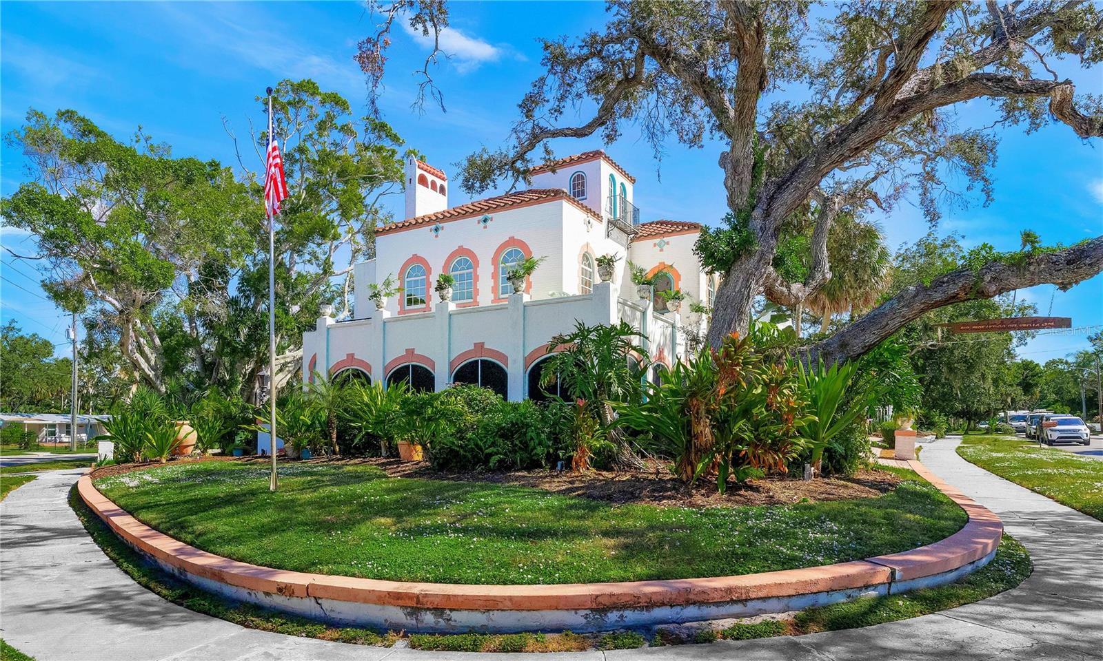 HISTORICAL HANDYMAN SPECIAL!!! -MAKE AN OFFER!!! PRICED $250,000 BELOW RECENT APPRAISAL!!!  HOUSE IS IN GOOD STRUCTURAL CONDITION BUT NEEDS COSMETIC REPAIRS AND UPDATING-RESTORE A PIECE OF HISTORY-Introducing “La Hacienda del Puesta Sol”, one of Sarasota’s most distinguished historic estates-an extraordinary Spanish Eclectic masterpiece residence built at the height of the 1920’s Florida boom. Positioned just steps from the shimmering waters of Sarasota Bay and Indian Beach, this nearly half-acre gated sanctuary blends architectural mastery, artistic heritage, and timeless history. This is a rare chance to own not just a home, but a legacy. Available for the First time in over Four Decades, The Albert Roehr Estate "La Hacienda del Puesta Sol" - The Estate of the Setting Sun- was officially designated a historical structure by the city of Sarasota, Florida in 1987. It may possibly qualify for National designation. The estate reflects the craftsmanship of its original owner, Albert Roehr, a celebrated artisan whose ornamental ironwork graces the gates of the John Ringling Mansion and landmarks throughout Sarasota and St. Armands. Written history and biography available upon request.

The main residence features 3 bedrooms and 3 full baths, filled with original hardwood floors, a grand hardwood staircase, Italian-style tile, ornate crown molding and original chandeliers.
A grand wrap-around screened porch captures breathtaking sunsets and sea breezes, accessible through French doors from the formal living room. The parlor and dining room showcase large sunny windows that keep the home bright and inviting. The kitchen includes natural gas, porcelain tile, Brazilian wood cabinetry with glass display, and stone countertops.

The expansive primary suite offers abundant windows, original wood floors, a masonry fireplace, and an en-suite bath. A private third-floor widow’s peak provides a secluded hideaway overlooking the bay, perfect for reflection or inspiration. The second bedroom opens to a rooftop sitting area overlooking Sarasota Bay’s private sunset moments. 

The property includes a historic carriage house with two rental opportunities: a downstairs studio and an upstairs 2-bed/1-bath apartment, each with separate entries. Short-term rentals (7-day minimum) are allowed, creating three potential income-producing residences on one property.

The artistic courtyard is a sanctuary—designed by the current owner, well-known commercial artist Norton Rock—resembles an old-world Italian street with a fountain, reflecting pool, concrete arches, and mosaics. It has hosted lavish events for ambassadors, business leaders, artists, and dignitaries and was often used as a creative setting for Ringling art students.

Set in the desirable Ringling neighborhood near the John & Mabel Ringling Museum and Mansion, this estate is minutes from downtown Sarasota, SRQ Airport, beaches, restaurants, and cultural attractions.

With a legacy of distinguished owners and residents—including Roehr himself, Herald-Tribune Editor George Lindsay, and well known historian and author Karl H. Grismer—this residence is more than a home. It is an irreplaceable piece of Sarasota history.

For those who feel drawn to authenticity, craftsmanship, and story—this isn’t just a home. This is your invitation to become part of Sarasota’s history. PLEASE VIEW VIRTUAL TOUR VIDEO