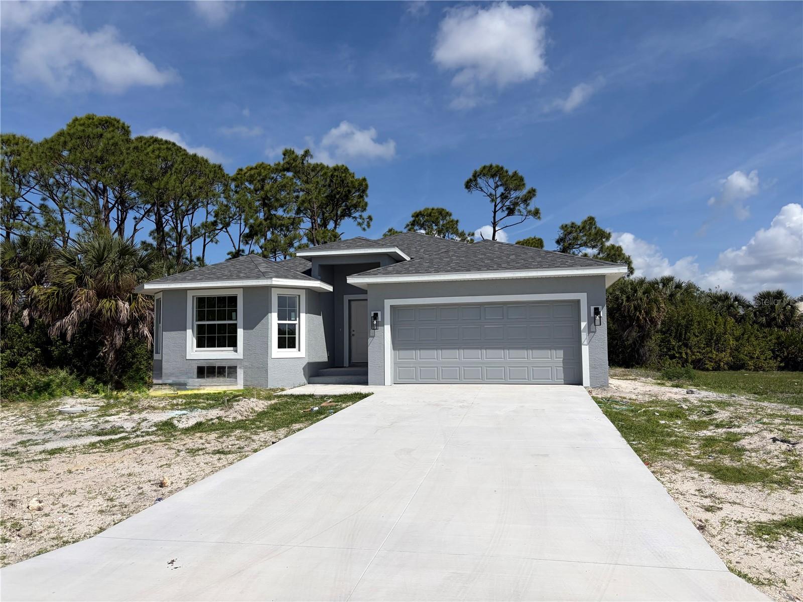 Beautiful Brand New Home!!! The Manatee 2 Model is a wonderful home design encompassing 3 bedrooms, 2 baths, and a 2 car garage across 1700 sq. ft. of living space. The open kitchen includes a walk-in pantry, spacious island, breakfast/dining area, and French Doors leading to the lanai. The master bedroom includes a walk-in closet, walk-in shower, and dual sink vanity. The remaining 2 bedrooms are located by a secondary bath which includes a shower. The home features cathedral ceilings, wood look tile throughout, granite countertops in the kitchen and bathrooms, recessed lighting, ceiling fans in every room, and stainless steel appliances. The home comes with hurricane/storm shutters. There is no wasted space in this home as it was designed for the discerning buyer who is looking to live the Florida lifestyle. Stop by today to see this beautiful home! Please call or text the listing agent for showing times.