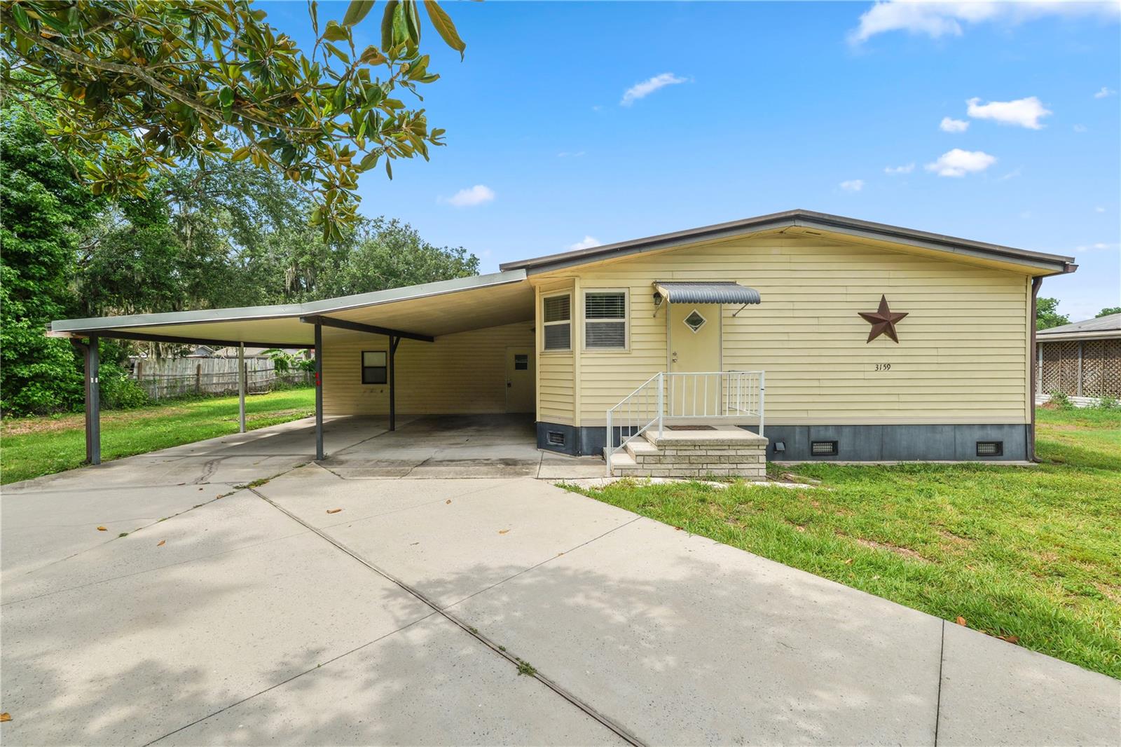 Wow! Affordable and spacious. Move-in ready and loaded with unique features! Situated on a large lot, this Lakeland home offers a fenced area for pets, a durable metal roof, and two dedicated A/C units for year-round comfort and efficiency. Inside, you'll find laminate flooring throughout the main living areas, carpeted bedrooms, and a convenient inside laundry room. The huge bonus room provides endless possibilities as a game room, man cave, media room, or home office. A rare bonus is the indoor, under-air shop/craft room—perfect for hobbies, crafting, woodworking, storage, or a dedicated workspace. Outside, a large storage shed with electricity adds even more flexibility. All appliances are included, making this home truly move-in ready. With versatile living spaces, valuable upgrades, and room to spread out, this is a property you won't want to miss!
