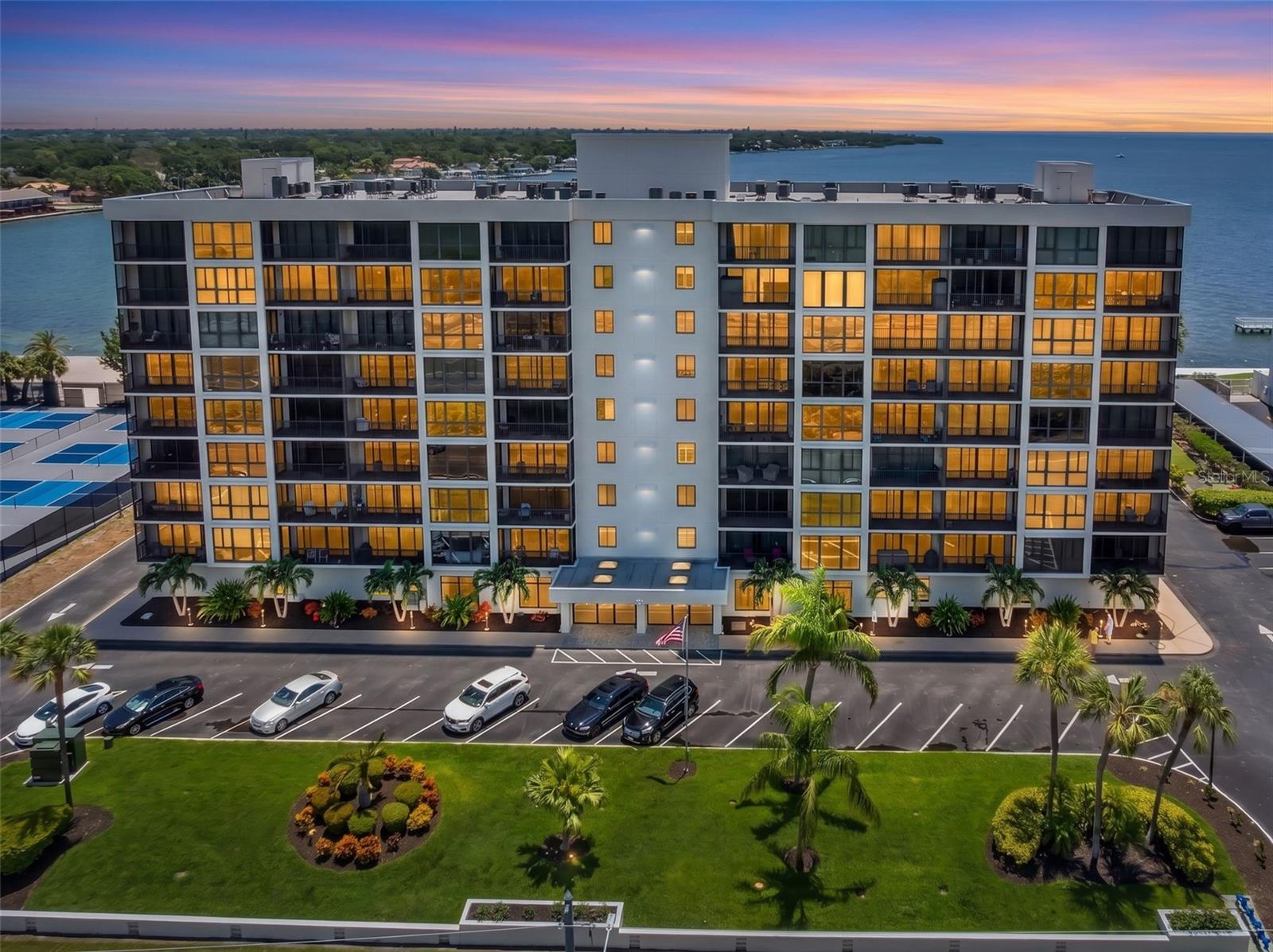 Water views from every room! Welcome to this stunning 7th-floor waterfront condominium offering breathtaking panoramic views toward Terra Verde and the Gulf from every room. Your monthly condo fee covers the community pool, reserves, exterior and grounds maintenance, pool maintenance, sewer, trash, water and your fitness facility as well as the community room with pool table! This beautifully updated 2-bedroom, 2-bath residence features two spacious en suite bedrooms, each with its own private screened porch—the perfect place to enjoy your morning coffee or unwind while taking in the waterfront scenery. The living room also opens to the screened lanai through sliding glass doors, creating seamless indoor-outdoor living. The light-filled great room combines comfortable living and dining spaces, all framed by spectacular water views. The updated kitchen is designed to impress with elegant quartz countertops, a decorative tile backsplash, white soft-close cabinetry, a pantry, breakfast bar seating, and a full suite of Frigidaire Gallery stainless steel appliances, including a microwave, five-burner range, dishwasher, and side-by-side refrigerator. The spacious primary suite offers gorgeous water views, a walk-in closet with custom built-ins, and an updated en suite bath featuring quartz countertops. A new shower door available to install; The second en suite bedroom provides privacy and equally impressive views. Additional conveniences include a second hallway entrance, a utility closet, storage closet, and separate linen closet. Residents enjoy exceptional community amenities, including a waterfront pool, a fishing/viewing dock extending into the bay, a fitness center on the first floor, and a laundry room conveniently located just off the elevator on each floor. Ideally located just minutes from award-winning Gulf beaches, shopping, dining, and vibrant downtown St. Petersburg, you'll have easy access to waterfront parks, museums, entertainment, and everything the area has to offer. This move-in-ready waterfront retreat combines spectacular views, thoughtful updates, and an unbeatable location—everything you need to enjoy the Florida lifestyle you've been dreaming of.