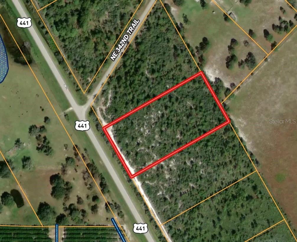 5 Acres located right on 441! The lot next door is also for sale. Property is high and dry with no wetlands. Currently zoned commercial with a future land use of rural activity center rural density. This property is an excellent opportunity to own a piece of rural Florida!