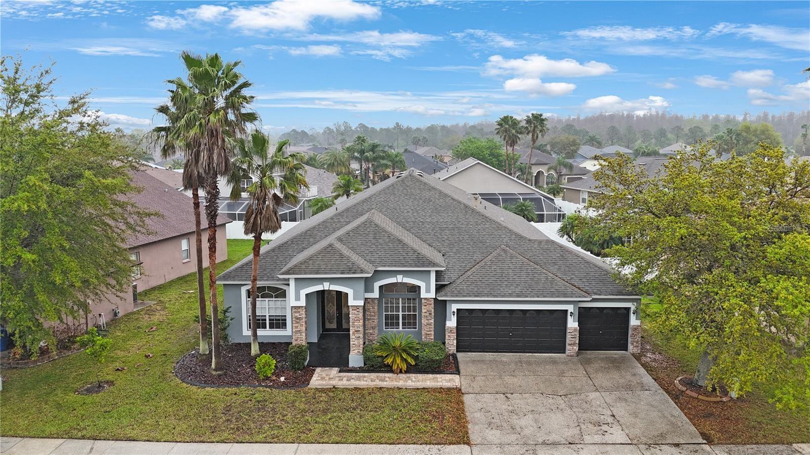 Discover this magnificent single family residence with five spacious bedrooms, three bathrooms, luxury swimming pool with spa home situated on a huge private 9840 sqft lot in gated Covington Estates. This beautiful maintained home features open floor concept, as you walk in the front door, you will be greeted by the formal dining room and office space. Step into the spacious modern kitchen with brand new granite counter top and brand new light fixture with all stainless steel appliance, the light filled living room designed for both relaxation and family gatherings, whether you envision cozy movie night, elegant entertainment or a comfortable retreat, this living room offers endless possibilities for endless family time. Step from the comfort of your spacious living room directly into the private backyard oasis where a sparkling swimming pool awaits whether to entertain guest or to rewind for the day. Escape to your private master suite, the en-suite bathroom boasts a spa like garden bath, with separate his and hers dual vanity, walk-in shower, walk-in closet and enclosed toilet room. Luxury vinyl flooring throughout the entire home with tile in wet area, no carpet for easy cleaning and maintenance. Enjoy hosting family and friends with the built-in outdoor grill and BBQ station, conveniently located near the pool for seamless entertaining. Weather you are grilling up a feast, lounging by the water, or simply enjoying outdoor dining under the open sky, this space is designed for year-round enjoyment. AC installed 2018, roof installed 2017, new water heater installed 2025. All of this in the exclusive community of Covington Estates at Cross Creek, conveniently near Cross Creek Park and with expedient access to I-75, I-275 and I-4. Plenty of shopping, dining and entertainment attractions in the neighborhood, golf courses and country clubs, The Shops at Wiregrass, Tampa premium outlet, USF, hospitals, Moffit center, MOSI, Busch Garden, Adventure Island, Tampa Zoo, Tampa Aquarium, Channel side, Tampa Downtown, Riverwalk, Armature Works, Tampa International Airport all can be reach in about 30 min drive. The sun shine state famous beach such as Clear water beach and St. Petersburg Beach can be reach in about 1 hour drive. Don't wait and schedule a showing today!