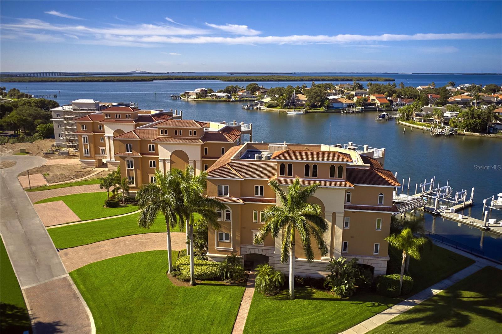 Spectacular, panoramic waterfront views are maximized by the strategic positioning of each 4-bedroom, 4.5 bath residence featuring over 3,800sq.ft. of living space, nearly 1,000sq.ft. of covered, wrap-around terrace, and walls-of-glass overlooking breathtaking views of Boca Ciega Bay, the marina below and the Sunshine Skyway Bridge on the horizon. With just three units per building, each penthouse-style unit commands an entire floor ensuring the ultimate luxury – PRIVACY. Unparalleled life-enhancing features include NO SHARED WALLS, a whole-building, 150kw natural gas GENERATOR, two high efficiency dual-zone AC systems, state-of-the-art smart home/media infrastructure and a unique Owners’ Suite with DUAL BATHS. The list is endless … 10’ ceilings integrated with LED up-lighting, Euro-style cabinets, Cambria countertops, large-format porcelain tile flooring, Great Room fireplace, and quietly tucked away on the tip of St. Petersburg in the gated community of Marina Bay next to Eckerd College, just 6 minutes to downtown St. Pete. Boat slips available. A private, secured, two-car Garage is included … as are St. Petersburg’s legendary sunsets. Simply magnificent.