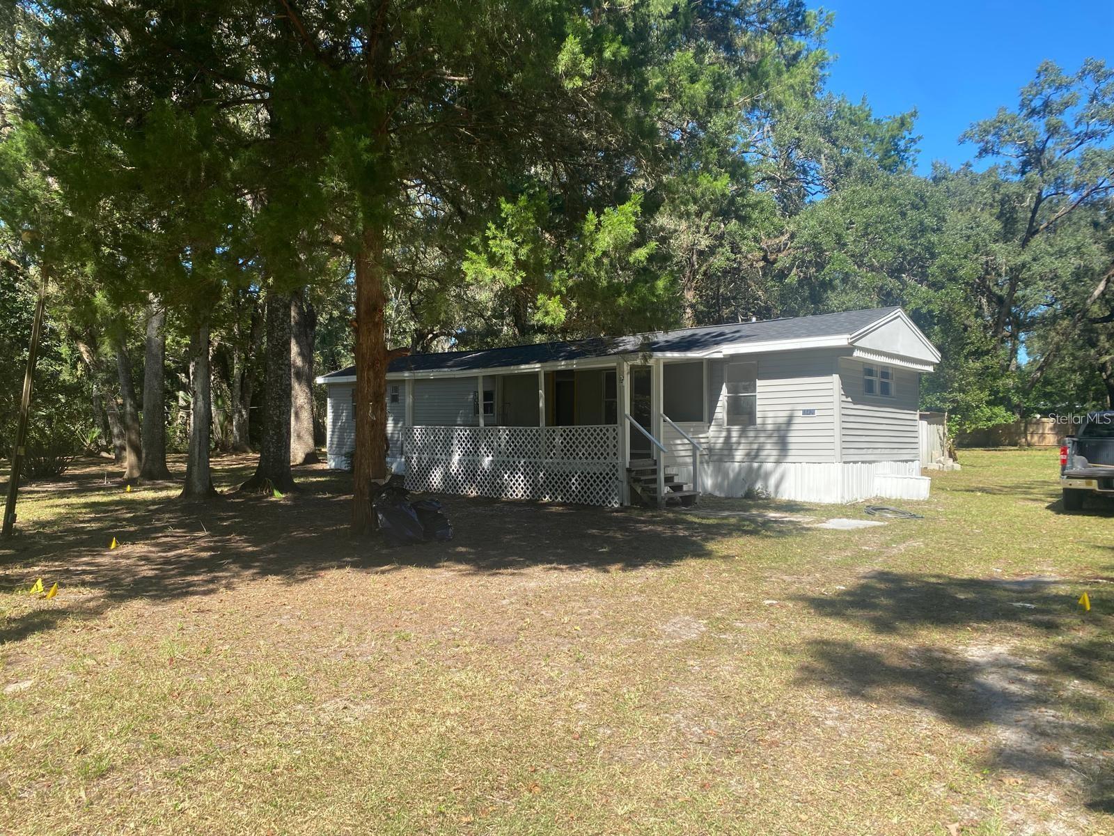 Welcome to your move-in ready retreat on nearly 1 acre of owned land in Brooksville. This 1980 HUD-code manufactured home (no lot rent) was fully renovated in 2025: new roof (including structural work), all new plumbing (supply & drain), brand-new appliances, new kitchen cabinets with dark stone countertops and backsplash, and two updated bathrooms with new ceramic tile. Efficient 2 bed / 2 bath (~784 sq ft living) with a smart layout, fresh finishes, and a big usable lot (˜39,180 sq ft) that gives you elbow room for boats, trailers, garden, or future improvements (verify with county). Peaceful street, easy access to the best of Brooksville and major corridors. If you’ve been hunting for a clean, turnkey manufactured home with land included, this one checks the boxes—updated systems, modern style, and space to breathe. Bring your best proposal and start enjoying Florida living on day one. Land owned.