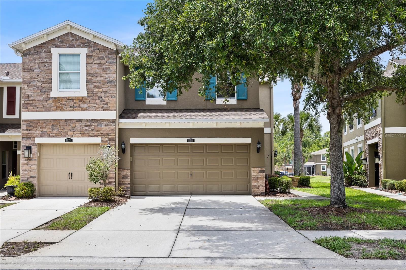 Welcome to this beautifully maintained end-unit townhome in the gated community of South Hampton, perfectly positioned on a premium pond-front homesite in one of the area's most convenient locations. Offering 2,230 square feet of thoughtfully designed living space, this spacious residence features 3 bedrooms, 2.5 bathrooms, a dedicated office, versatile loft, and a 2-car garage.

From the moment you step inside, you'll appreciate the open-concept layout, abundant natural light, and numerous upgrades throughout. The inviting great room showcases wood-look tile flooring and crown molding, with seamless flow into the dining and kitchen areas, creating the perfect space for everyday living and entertaining. Large sliding glass doors lead to the screened lanai, where tranquil pond views provide a peaceful backdrop for morning coffee or evening relaxation.

The well-appointed kitchen is the heart of the home and features 42-inch cabinetry with decorative glass display cabinets, crown molding, granite countertops, stainless steel appliances, a spacious center island with seating, and ample storage and prep space for the home chef. The first floor also includes a private office ideal for working from home, a convenient powder bath, and additional storage space.

Upstairs, the oversized primary suite offers a true retreat with peaceful pond views, a large walk-in closet, and an ensuite bathroom featuring dual granite vanities, a spacious walk-in shower, and plenty of storage. Two additional bedrooms, a full bathroom, and an expansive loft provide flexibility for guests, a media room, playroom, or second living area.

Additional highlights include upgraded lighting fixtures, a water softener, and washer and dryer that convey with the home. Residents enjoy the security of a gated entrance, a low-maintenance lifestyle, and access to community amenities including a resort-style pool and playground. Ideally located just minutes from Citrus Park Mall, Westchase, Oldsmar, shopping, dining, parks, and major commuter routes, this home is also zoned for highly rated Mary Bryant Elementary, Farnell Middle School, and Sickles High School.

Combining spacious living, beautiful pond views, desirable community amenities, and an unbeatable location, this exceptional townhome offers the perfect blend of comfort, convenience, and Florida living.