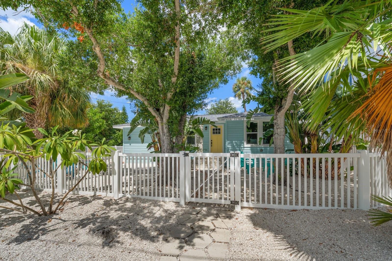 Introducing “The Coconut Cottage,” an exceptional Downtown Dunedin Bungalow where timeless coastal charm meets modern luxury in one of the area’s most sought-after locations. Perfectly positioned within the coveted Downtown Core (DC), this rare offering is just two blocks from Main Street, moments from the Gulf of Mexico and located in a non-flood zone with NO HOA. Even more remarkable, the property is zoned for both residential and commercial use, allowing Short-Term Rentals (daily, weekly, monthly, or annual), creating a truly unique lifestyle and investment opportunity. Thoughtfully renovated with an effortless blend of finishes and authentic bungalow character, this 3-bedroom, 2-bath residence welcomes you with soaring vaulted ceilings, abundant natural light and an open-concept design that lives far larger than expected. Every detail has been carefully curated, from the wide-plank bamboo luxury waterproof flooring and coastal farmhouse trim to the matte black hardware, designer lighting, LED recessed lighting, hurricane-impact windows, and French doors that seamlessly connect indoor and outdoor living. At the heart of the home, the beautifully appointed kitchen combines style and functionality with soft-close white shaker cabinetry, butcher block countertops, a classic white beveled subway tile backsplash, Frigidaire Gallery Series appliances, a movable center island, and a dedicated interior laundry area complete with premium LG washer and dryer. Designed with privacy in mind, the desirable two-way split floor plan features a tranquil primary suite tucked away from the guest bedrooms. The en suite bath evokes a boutique coastal retreat with its striking blue subway-tiled walk-in shower, penny tile flooring, updated vanity, and refined finishes. Two additional bedrooms are thoughtfully positioned on the opposite side of the home and share a spacious, beautifully updated guest bath.
Significant improvements provide exceptional peace of mind, including a 2023 Roof, 2019 A/C, updated electrical and plumbing, hurricane-impact windows and a craftsman-style front entry door. Outside, the inviting yard offers a private coastal setting complete with crushed shell walkways, a fenced yard, a charming fire pit gathering area, additional storage and ample rear parking on the spacious corner lot.
The lifestyle is simply unmatched. Walk to Main Street’s award-winning restaurants, boutique shopping, breweries, the Pinellas Bike Trail, Dunedin Marina and spectacular waterfront sunsets at Edgewater Park. Leave the car behind or hop in your golf cart and experience one of Florida’s most beloved coastal communities exactly as it was meant to be enjoyed. Whether you’re seeking a distinctive primary residence, an elegant seasonal escape, an income-producing Short-Term Rental, The Coconut Cottage delivers a rare combination of location, versatility and enduring appeal. Extraordinary opportunities like this seldom become available in the heart of Downtown Dunedin. This is more than a home—it’s an invitation to embrace the quintessential Florida coastal lifestyle while owning one of Dunedin’s most unique and desirable properties.