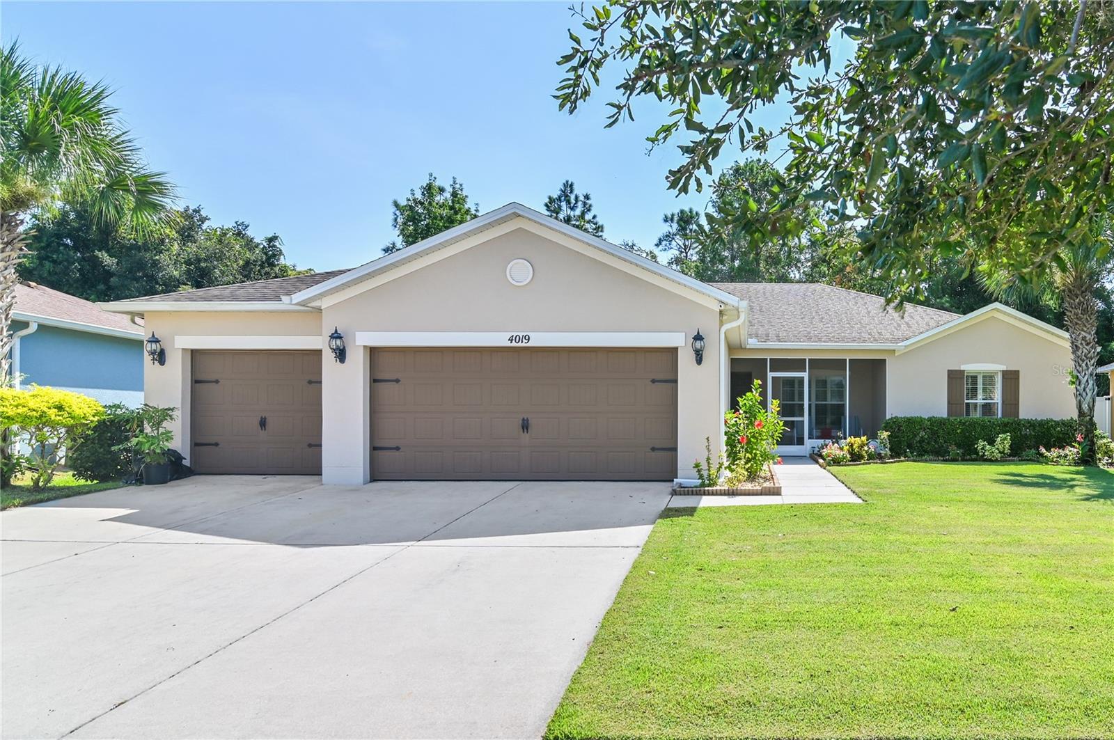 *PRICE IMPROVEMENT* Welcome to this lovingly cared for and meticulously maintained 3-car garage home located in a gated community just off of Pleasant Hill Road in Kissimmee. Pride of ownership exudes throughout this beautiful home and is evident from the moment you arrive as you're greeted by the well-manicured Zoysia grass lawn. Boasting over 2100 sq ft, this lovely home has 4 spacious bedrooms, with the master suite being split from the three guest bedrooms thereby making it a true retreat. Other notable features include tile throughout the home (including the bedrooms), plantation shutters on almost all of the windows, a large screened-in front porch, an even larger screened-in lanai and a fully fenced backyard. This beautiful home is conveniently located close to many shopping centers with Valencia College Poinciana Campus just a short drive away. Schedule a private showing today to see this wonderful home in person.