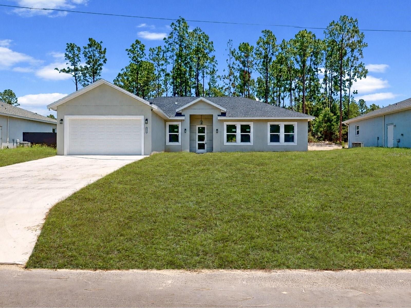 Looking for a stunning brand-new home with your own private pool? This gorgeous newly built custom home located in Ocala is perfect for you! Enjoy needed peace and serenity thanks to it being on a private lot. This dream home will stun all as soon as you enter, be greeted by its open floor plan and enchanting design with the walls and floor clad in dazzling gray. Such a captivating look which is enhanced by the quartz countertop and custom cabinets that clash the matte charcoal handles, stainless steel appliances, and overhead lighting creating a spectacular harmony of colors! A major upside is the private pool surrounded by pavers, a rare sight in Ocala; beat the heat and host your own events with this patio! Three bedrooms and two bathrooms means there is enough room for you and your potential family. Come make this absolute beauty yours today!
