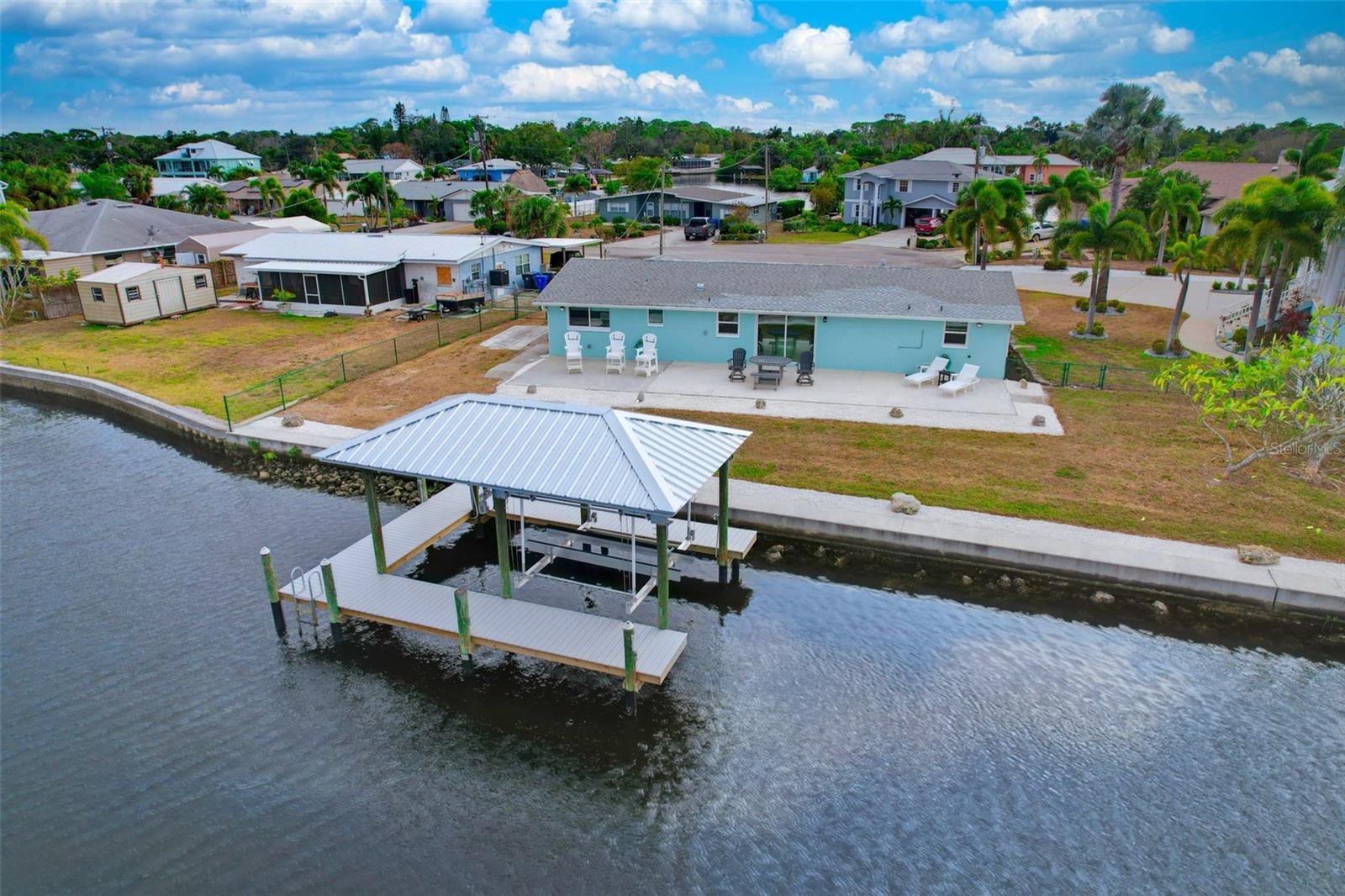A Rare Opportunity for Effortless Waterfront Living
This home offers the chance to own along one of Ruskin’s most spectacular waterways—an opportunity that rarely comes to market.
Enjoy stunning sunsets and front-row seats to dolphins and manatees playing right in your backyard. Tucked away on a quiet cul-de-sac, this home provides privacy, tranquility, and the relaxed Florida lifestyle buyers are seeking.
Inside, the 2-bedroom, 2-bath layout offers just under 1,600 sq. ft. of bright, welcoming living space. A massive back patio overlooks the inlet—perfect for morning coffee, unwinding in the evenings, or entertaining year-round.
The updated kitchen features painted mahogany cabinets, granite countertops, upgraded stainless steel appliances, and stylish tile finishes. Durable ceramic tile flooring flows throughout the home, making maintenance effortless and ideal for waterfront living.  Quality Impact resistant windows have been installed in this home as well as a Hurricane-resistant Garage door, Gutters, Electric Water Heater, faucets in kitchen & baths and Interior Doors have recently been upgraded for maintenance free peace of mind.  The A/C system was upgraded 4 years ago and the entire Interior and Exterior has been freshly painted.
**A Boater’s Paradise**
The recently constructed covered boathouse and dock, complete with a powered boat lift, water, and electricity, can accommodate a boat up to 26'. With deep-water Ruskin Inlet frontage and direct, bridge-free access to Tampa Bay, you can head out fishing, cruise at sunset, or reach Gulf of America waters with ease. The seawall has also been recently reinforced with riprap stone, providing added durability and long-term protection against erosion.  Bring your boat, jet ski, paddleboards, and fishing gear—this home is built for all of it.
Homes offering water access, breathtaking views, no HOA, and this level of care and restoration are extremely rare at this price.  All flood-related repairs from the 2024 storms have been fully and professionally completed, giving you peace of mind and a beautifully refreshed interior ready for its next owner. With its unmatched setting, revitalized condition, and no HOA, this property delivers exceptional long-term value.
Come experience relaxed waterfront living at its finest—your Florida lifestyle awaits.