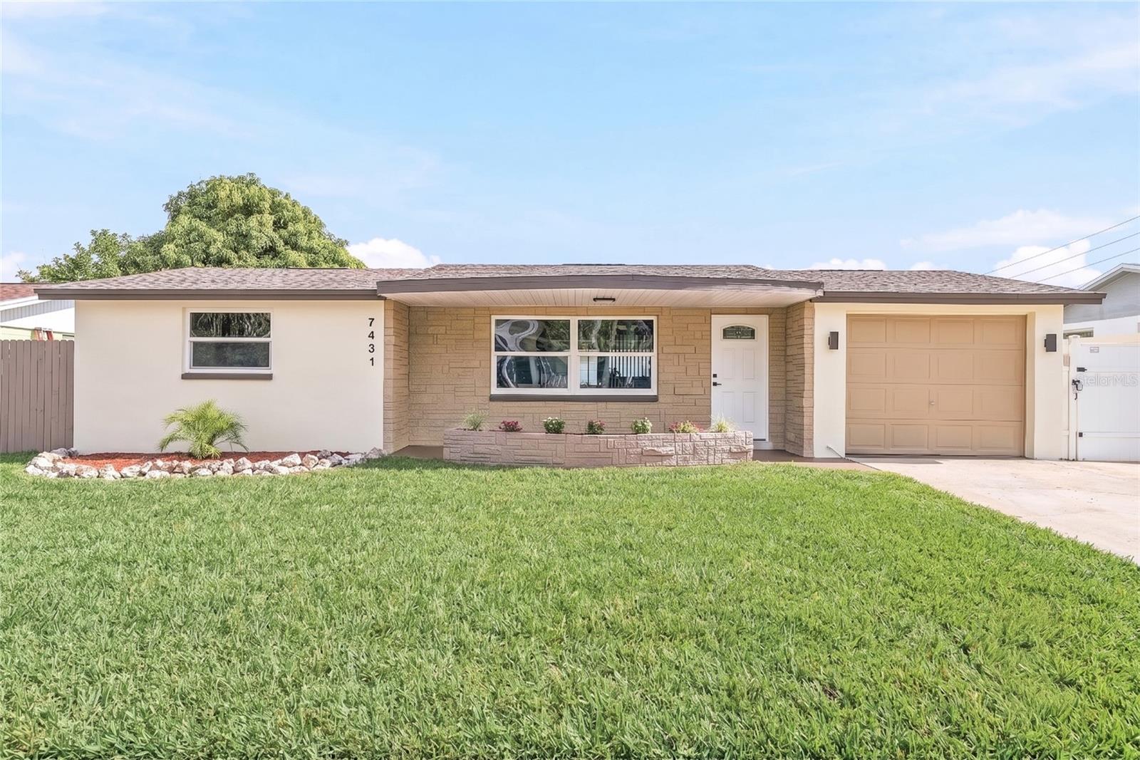 Completely renovated from top to bottom, this move-in ready 3-bedroom, 3-bathroom block pool home with a 1-car garage offers the perfect combination of modern updates, functional living space, and everyday comfort. With major improvements already completed, including a brand-new A/C, brand-new water heater, new flat roof, and a 2020 shingle roof, you can enjoy peace of mind from day one.

A charming covered front porch with welcoming flower beds sets the tone before you step inside to an open floor plan featuring durable luxury vinyl plank flooring throughout the main living areas. The beautifully updated kitchen is designed to be the heart of the home, offering abundant cabinet storage, soft-close cabinetry, quartz countertops, a spacious island with convenient pop-up outlets, and all-new appliances. Just beyond the kitchen is an additional living area that offers endless flexibility as a family room, formal dining space, playroom, or home office. The thoughtfully designed layout provides privacy for everyone. One bedroom is tucked away at the rear of the home with its own beautifully remodeled en suite bathroom, making it an ideal guest suite or private retreat. The primary bedroom also features its own beautifully updated en suite bathroom, while the fully remodeled guest bathroom provides added convenience for family and visitors. The primary en suite and guest bathroom are accented with sleek LED mirrors, while all three bathrooms showcase stylish modern finishes. Step outside to your own backyard oasis featuring a sparkling blue in-ground pool, patio space, fully fenced yard, and a storage shed for all of your outdoor equipment and hobbies. Whether you're hosting family and friends or simply enjoying a quiet afternoon by the pool, this outdoor space is ready to be enjoyed.

Conveniently located in Port Richey, you'll be just minutes from shopping, restaurants, parks, schools, and everyday conveniences, with easy access to US-19 for commuting throughout Pasco County. Plus, you're only a short drive from waterfront parks, boat ramps, and the beautiful Gulf Coast, making it easy to enjoy everything Florida living has to offer.