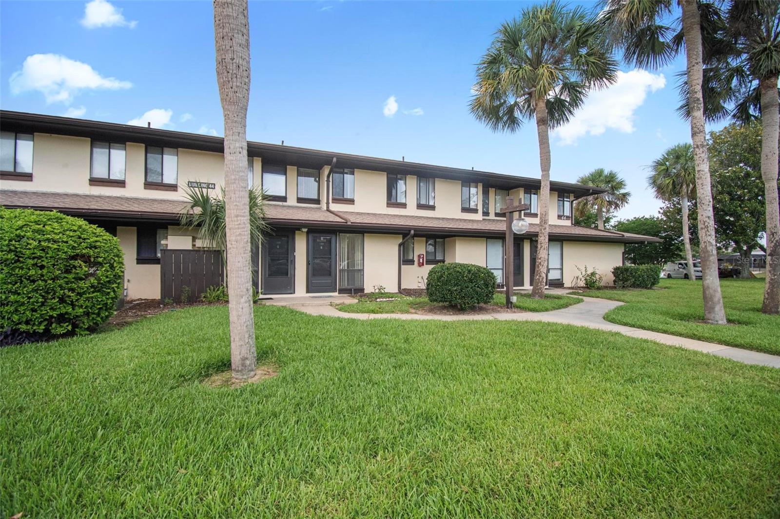 WATERFRONT LIVING - Palm Club Townhouse is situated on a large saltwater canal where you can watch directly from your balcony the boats passing buy and enjoy beautiful sunsets.  Many amenities are included, a resort style pool, clubhouse, and a scenic walking path.
HOA covers water, trash, cable/internet and pest control.  Palm Harbor Golf Course is across the road and Island Walk is close by for your shopping needs, including, restaurants, banks and a Public's grocery store. First floor is living/dining room, kitchen, half-bath and patio overlooking the saltwater canal.  Second level has two bedrooms and a full bath. Main bedroom has a balcony overlooking canal to enjoy the water activities.   There is a chair lift for navigating the stairway.
This is resort living at its best as well as peace of mind when vacationing or for snowbirds... just lock your door and no worries.
Call Realtor before showing