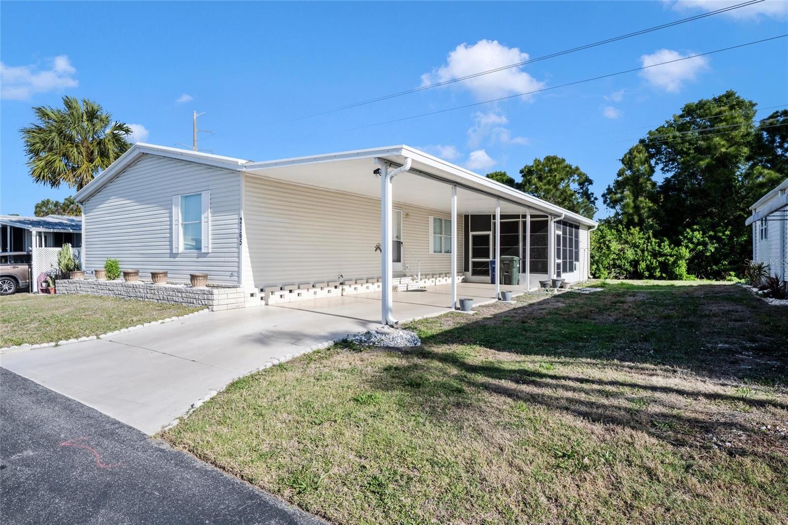 Welcome to your slice of paradise in Sarasota—one of Florida’s most desirable places to live! This Palm Harbor top-of-the-line model is located in the highly sought-after Venetian Park Estates, a vibrant and active 55+ manufactured home community, this beautifully furnished residence is a double-wide, 3 bedroom, 2 full bathroom home offers the perfect blend of comfort, style, and convenience. 

Step inside to discover a spacious, thoughtfully designed interior boasting charming country flair.  The split-floor plan, open concept layout home is being sold turn-key furnished and features an eat-in kitchen (a dinette room) custom cabinetry and a pantry! The primary bedroom has a walk-in closet, en-suite bathroom with a soaking tub and separate shower.  Bedroom #2 also offers a walk-in closet. An additional highlight includes convenient indoor laundry.
There is a screened lanai with Florida glass (a vinyl material) off of the kitchen, and large storage area and covered car port parking. Located just a short drive to the world-renowned Siesta Key Beach voted #1 in USA again, and only minutes from everyday essentials including Target, Walmart, and Costco, downtown Sarasota this location truly has it all.
Whether you're seeking a seasonal getaway or a full-time residence, this move-in-ready home is equipped with everything you need to enjoy the Florida lifestyle you've always dreamed of. This home backs to green space for privacy and tranquility when desired. Two parking spaces.

Boats and RVs have special parking areas. The community offers a Pool, Hot Tub, Club House and activities! Don’t miss this opportunity to own in one of Sarasota’s most welcoming and active communities with pool, Clubhouse and more where residents have water, sewer, trash, and internet included in association fees.