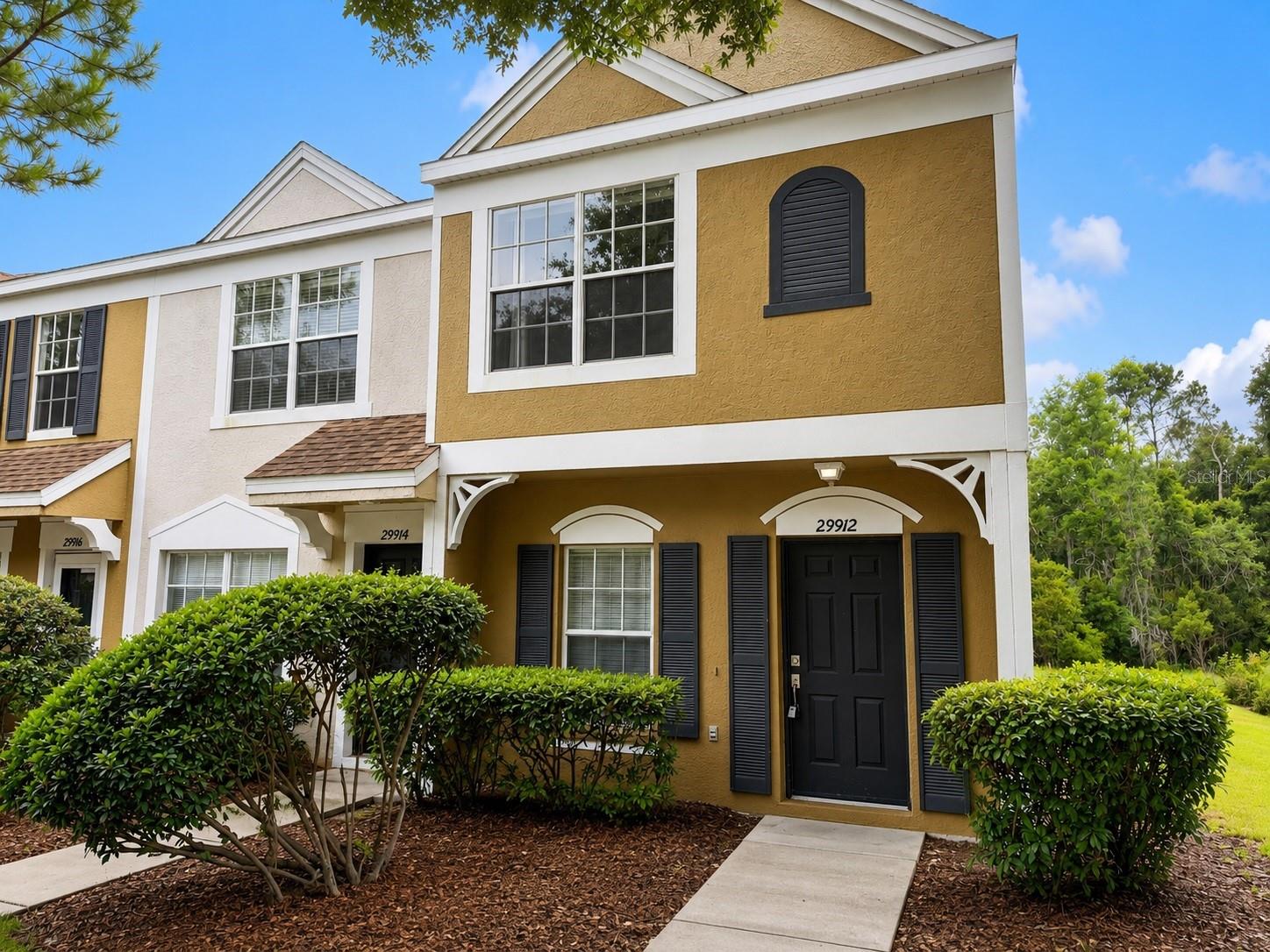 Virtually Staged. Welcome to this beautifully maintained corner-unit townhome in the gated community of Covina Key at Meadow Pointe II in the heart of Wesley Chapel. Offering peaceful pond views and added privacy, this move-in-ready home features a bright, open-concept floor plan with spacious living and dining areas that flow seamlessly into the kitchen, making it ideal for both everyday living and entertaining.
The home features tile and laminate flooring throughout, providing a modern look with easy maintenance. Upstairs, you’ll find generously sized bedrooms, including a spacious primary suite with a private bath and ample closet space. Relax on the covered lanai while enjoying tranquil pond views from this premium corner location. Residents enjoy a maintenance-free lifestyle with access to Covina Key’s private pool, as well as Meadow Pointe II’s exceptional amenities, including a clubhouse, fitness center, resort-style pool, tennis and basketball courts, playgrounds, and walking trails. Ideally located just minutes from Wiregrass Mall, Tampa Premium Outlets, AdventHealth, BayCare Hospital, top-rated schools, restaurants, entertainment, and convenient access to I-75 and I-275, this home offers the perfect combination of comfort, convenience, and location.