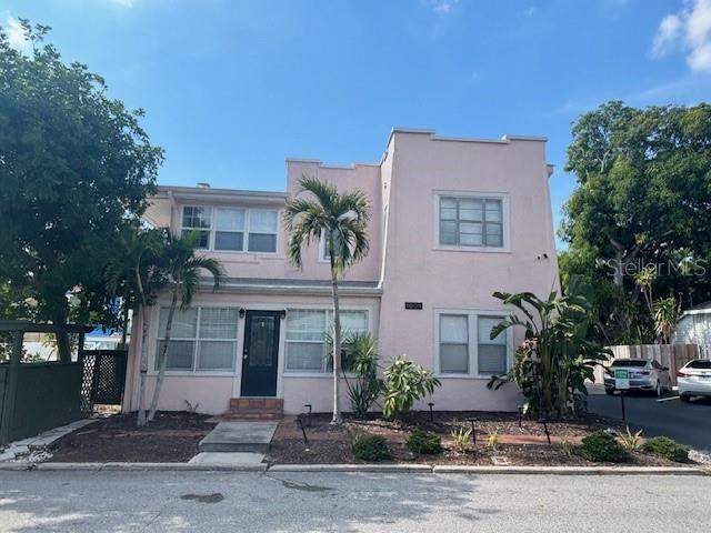 No HOA! No Condo Management! X flood zone!  6 income producing units. Each unit has its own electrical meter and hot water units. One water meter for all. Cute as a Button! Fall in love with investing all over again, own a charming set of Florida style buildings renting out to long term tenants. There are two buildings.  The first has two units, one upstairs and the other downstairs, both with 2 bedrooms, a bathroom with tub and shower, an eat in kitchen, large living room (fire place) and downstairs has a converted Florida room too could be a guest bedroom study or office.  The back building has 4 units, each 1 bedroom one bathroom. There are 6 car spots, one for each unit.