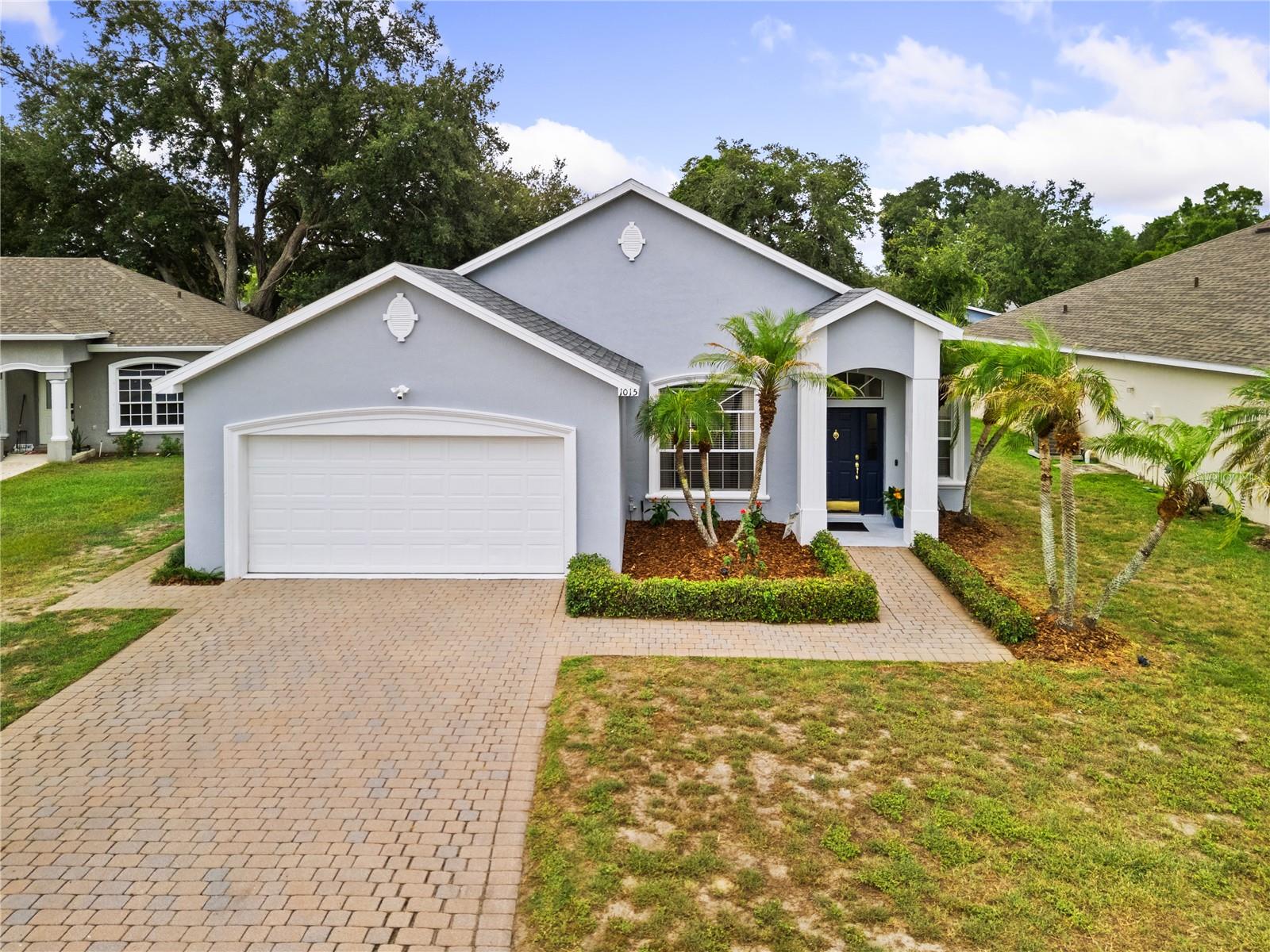 Welcome to this beautifully maintained 3-bedroom, 2-bathroom home tucked away on a quiet cul-de-sac in the desirable Audubon Place community of Southeast Winter Haven. Offering exceptional curb appeal with fresh interior and exterior paint, this move-in-ready residence showcases quality craftsmanship and extensive updates, including a NEW ROOF (2023), a BRAND-NEW HVAC system with ALL NEW DUCTWORK (2025), and a REME HALO whole-home air purification system (2025) for enhanced indoor air quality and year-round comfort.

Inside, you'll be welcomed by soaring 12-foot ceilings, elegant rounded corner walls, extensive crown molding, detailed architectural arches, and an open-concept floor plan designed to maximize space and natural light. Tray ceilings enhance every bedroom, adding an extra touch of sophistication throughout the home. The chef-inspired kitchen is beautifully appointed with granite countertops, stainless steel appliances, crisp white cabinetry, under-cabinet lighting, and a large walk-in pantry offering abundant storage. The adjoining living area features rich flooring, a tray ceiling, a built-in media alcove, and expansive windows that create a warm and inviting atmosphere.

The private primary suite serves as a relaxing retreat with a tray ceiling, spacious walk-in closet, and a luxurious ensuite bathroom featuring granite countertops, a dual-sink vanity, a dedicated makeup station, a soaking tub, and a separate walk-in shower. The additional bedrooms are generously sized, while the oversized laundry room offers exceptional functionality with built-in cabinetry, a utility sink, and included Maytag commercial washer and dryer.

Step outside to your own private backyard oasis featuring a beautiful paver lanai, matching paver walkway and 2 car garage with paver driveway and an expansive screened outdoor living space complete with ceiling fans and an included hot tub. The fully fenced backyard is surrounded by mature landscaping, providing the perfect setting for entertaining, relaxing, or enjoying Florida's year-round sunshine. For added value, the drapes and area rugs throughout the home will remain, making your move even easier.

Located in a well-maintained community with a low HOA of just $38 per month, residents enjoy peaceful streets, attractive deed restrictions, and a prime location just minutes from shopping, restaurants, the Audubon Sanctuary with scenic walking trails, Garden Grove Elementary School, the Audubon Nature Trail, LEGOLAND Florida Resort, Peppa Pig Theme Park, Downtown Winter Haven, Winter Haven Hospital, and the area's renowned Chain of Lakes. With convenient access to Highway 27 and the Polk Parkway, commuting to both Orlando and Tampa is simple. Beautifully updated, thoughtfully maintained, and truly move-in ready, this exceptional home offers timeless style, modern comfort, and quality upgrades throughout.