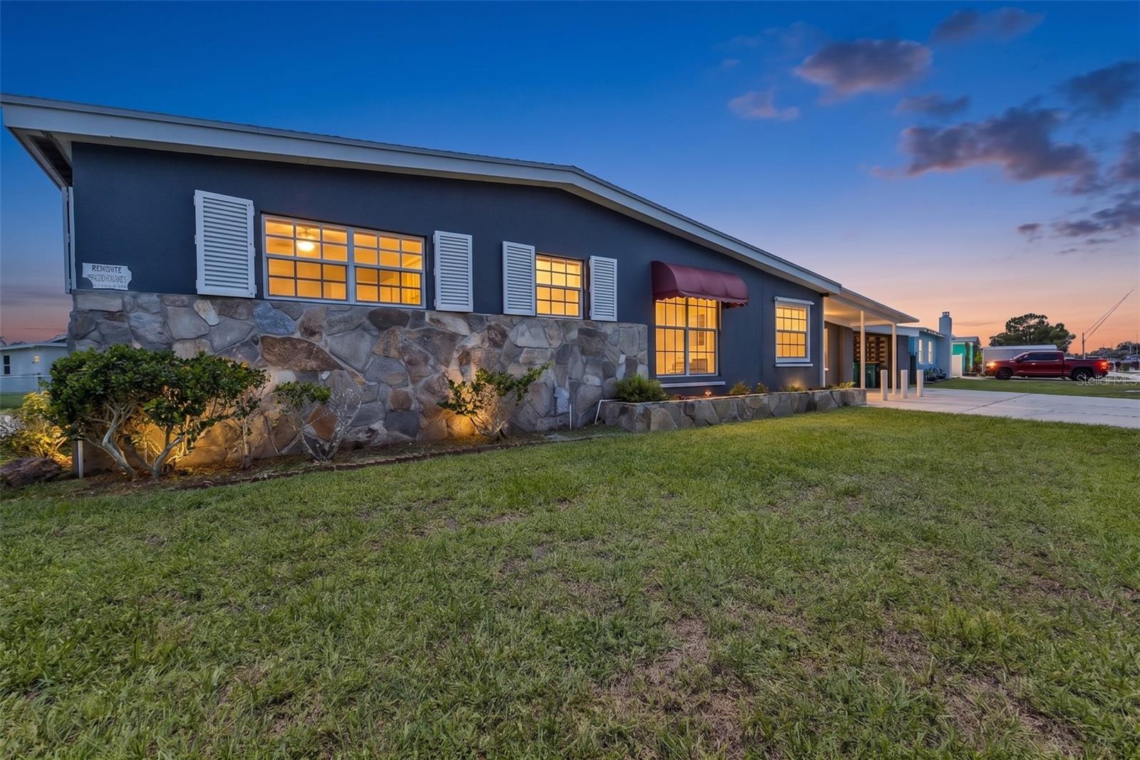 The best homes don’t just meet your needs today—they continue to adapt as life changes. Offering a thoughtfully designed floor plan with flexibility in mind, this unique Port Charlotte property is ideal for multigenerational living, extended family, or anyone seeking adaptable living space that grows with their lifestyle.
One of the home’s most distinctive features is a private entrance leading to a separate multigenerational suite complete with its own full bathroom and interior access to the main home through a locking door. Formerly configured as a hair salon, this versatile space offers exceptional flexibility as a private guest suite, home office, studio, hobby room, caregiver’s space, or other permitted use (buyer to verify with Charlotte County). 
The main living area offers generous spaces designed for both everyday living and gathering with family and friends. A spacious kitchen with abundant cabinetry overlooks the heart of the home, while the wood-burning fireplace adds warmth and character rarely found in Southwest Florida. The enclosed Florida room provides additional living space, creating the perfect place to enjoy your morning coffee, entertain family and friends, or simply unwind while overlooking the privacy-fenced backyard.
Step outside to enjoy the privacy-fenced backyard, detached storage shed, covered parking, and plenty of room to embrace the Florida lifestyle. Thoughtful improvements over the past several years include a 2025 front porch and carport replacement, a 2023 roof replacement and electrical riser, a 2022 electrical panel, a 2018 water service replacement, plus hurricane shutters—providing added value and peace of mind. 
With no HOA or deed restrictions, you’ll enjoy the freedom to keep your boat, RV, trailer, or other recreational toys at home (subject to local regulations), making this property an exceptional choice for those who appreciate the freedom to enjoy everything Southwest Florida has to offer.
Ideally located in the heart of Port Charlotte, you’ll be just minutes from Publix, shopping, restaurants, medical facilities, parks, schools, Charlotte Sports Park, Sunseeker Resort Charlotte Harbor, public boat ramps with direct access to beautiful Charlotte Harbor and the Gulf of Mexico, US-41, I-75, and historic downtown Punta Gorda. You’ll also appreciate being near the exciting growth and redevelopment taking place throughout the nearby Murdock Village and West Port areas, bringing even more shopping, dining, entertainment, and opportunity to this thriving community.
Whether you’re welcoming multiple generations under one roof, creating a private space for guests, working from home, or simply searching for a home that can adapt as your lifestyle changes, this one-of-a-kind property offers the flexibility today’s buyers are looking for. It’s time to stop dreaming and start making your Florida Sunshine Days a reality!