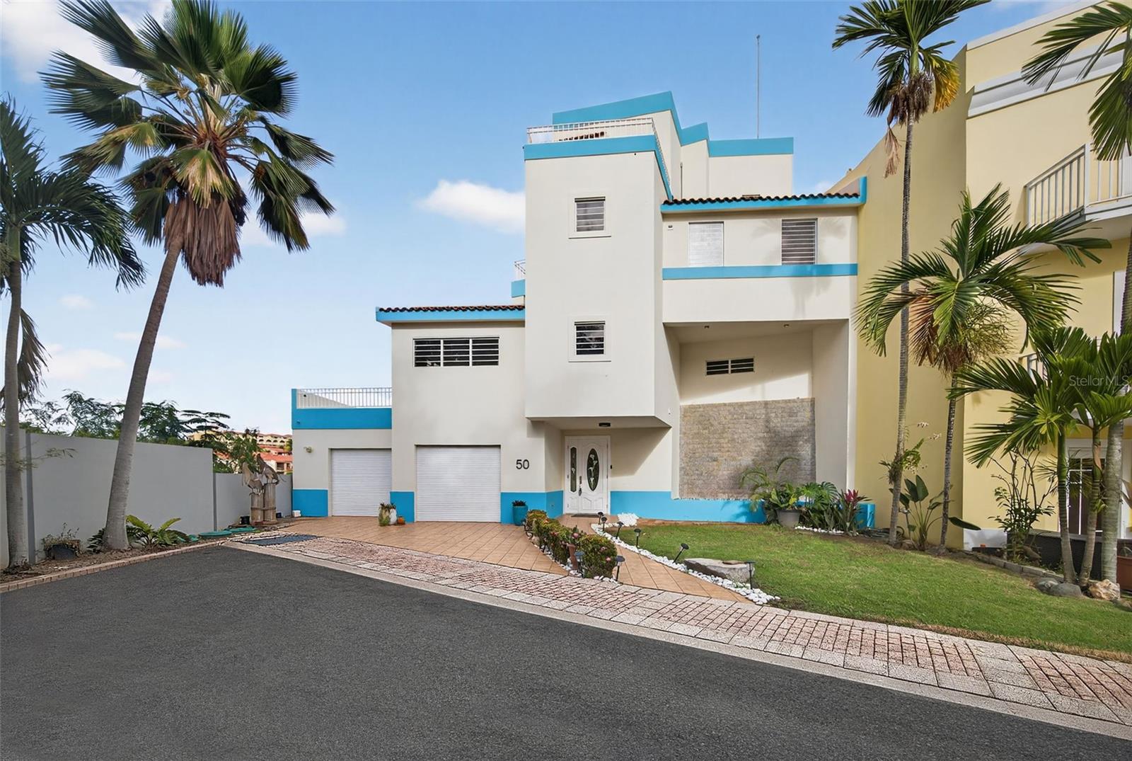 This beautiful residence features 4 bedrooms and 5.5 bathrooms, encompassing 4,500 square feet of heated living space. The property is located in the Península de San Juan community within Palmas del Mar, Humacao, situated on a 437.08 square meters lot that offers a perfect blend of interior comfort and outdoor potential.

Humacao, famously known as The Gray City, is home to Palmas del Mar, one of the largest and most complete master-planned communities in the Caribbean, featuring its own K-12 academy, a deep-water marina, and the largest equestrian center on the island.

Delivering expansive interiors designed for refined coastal living, this exceptional waterfront estate offers a total of 7,314 square feet including private balconies. A true boater’s dream, the property features two 55-foot side-by-side private boat slips, plus two additional side-by-side guest boat slips, providing rare and direct marina access. The residence includes a double garage, an elegant wine cellar, and a fully autonomous energy system equipped with a 40kW full-power generator, 27 solar panels, and two Tesla batteries, ensuring efficiency, reliability, and peace of mind. Breathtaking water views and immediate access to the world-class amenities of Palmas del Mar complete this unique offering.

CRIM: $3,149.00 (annually)

HOA: $530.00 (monthly) 

Palmas del Mar Association: $1,300.00 (annually)