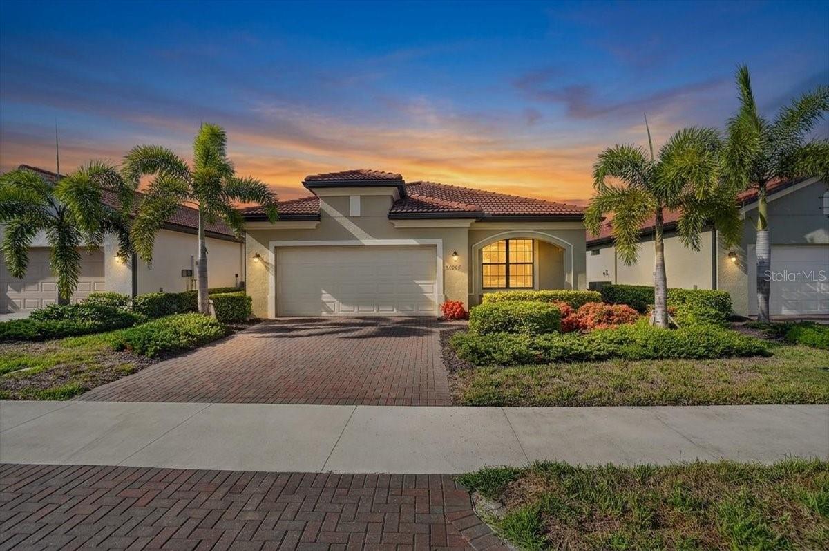 Nestled within the highly coveted community of Sarasota National, this stunning 2-bedroom plus office, 2-bathroom residence offers the perfect blend of luxury, comfort, and active living. From the moment you arrive, you’ll realize this isn't just a house—it’s the backdrop to your next great chapter, complete with two included golf memberships to elevate your daily routine.

Step inside and be greeted by an inviting, sun-filled open floor plan designed with modern living in mind. The space feels brilliantly "zoned," with the living and dining areas purposefully situated on opposite sides of the kitchen. This thoughtful layout offers the best of both worlds: effortless flow for entertaining, yet distinct areas for cozy relaxation and formal dinners. No matter which "zone" you choose to unwind in, you'll enjoy a continuous stream of beautiful natural light throughout the day, courtesy of the home's highly desirable South-facing backyard.

At the heart of the home is a beautiful, classic kitchen featuring rich dark brown cabinetry and an expansive center island equipped with a sink for ultimate convenience. The interior acts as a pristine canvas, boasting bright, light walls ready for your personal design touch or custom accent walls, seamlessly complemented by light, natural-toned flooring. Enjoy the stress-free maintenance of sleek tile throughout the main living spaces, and transition into the plush, cozy carpet of the bedrooms at the end of the day.

The primary suite serves as your private sanctuary, complete with an elegant ensuite bathroom featuring a spacious walk-in shower and a generous walk-in closet. Need a dedicated space to work or create? The versatile home office, sealed with elegant French doors, offers the perfect quiet retreat.

The true magic of Florida living awaits just past your living room. Step out onto the extended lanai and take a deep breath as you gaze out over a peaceful, undisturbed preserve view. Whether you're sipping your morning coffee or hosting a sunset happy hour, this private outdoor oasis is pure tranquility.

Located in a premier neighborhood renowned for its world-class resort amenities, you are just a short drive from pristine Gulf beaches, upscale shopping, and vibrant local dining.

Don't just dream the lifestyle—live it. Schedule your private tour today!