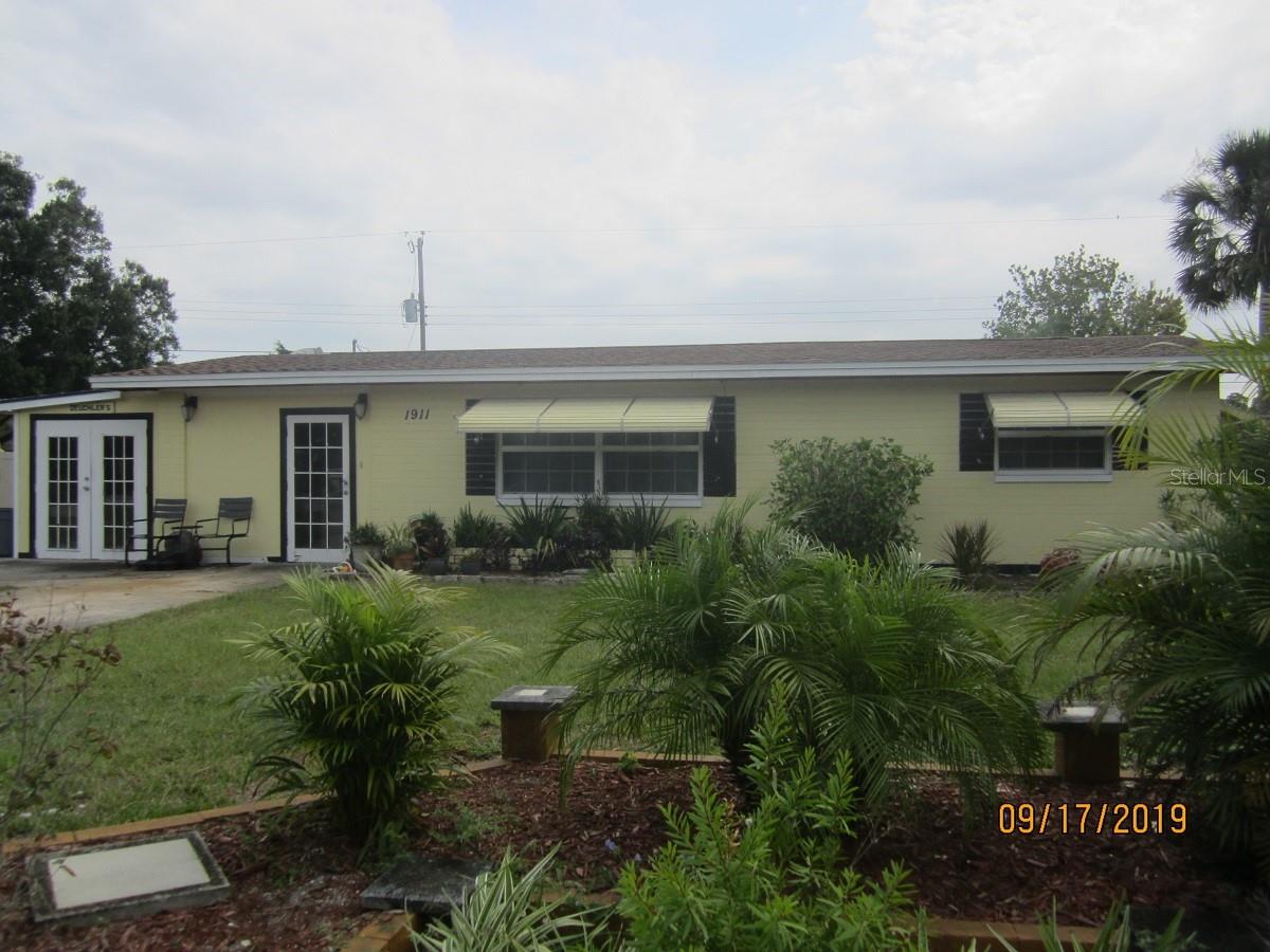 Comfortable home backs up to pond offering a tranquil setting. Spacious living room with tile flooring. Large screen room.
Work Shop with Laundry area has plenty of shelving and space for your projects. New roof 2 years ago. A/c less than 2 years old. ;Water: City