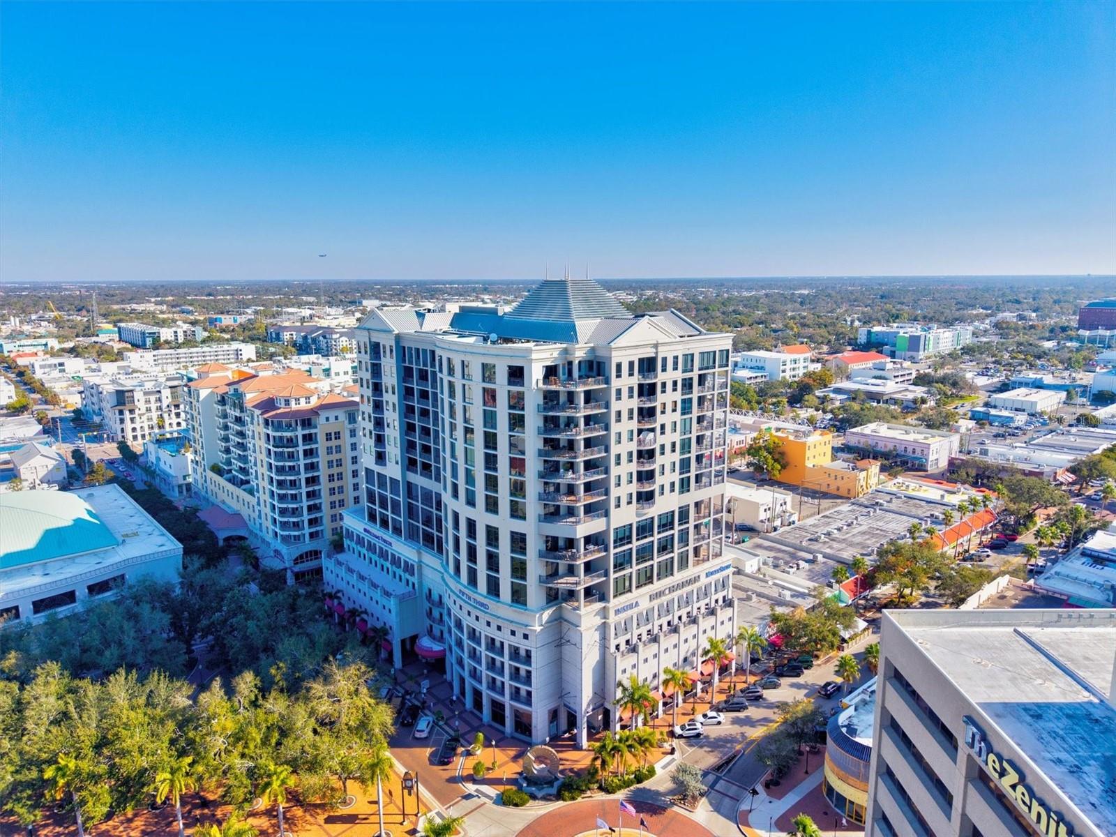 New Price- for this PRISTINE residence on Central Ave, a rare opportunity to live at the HEART of downtown Sarasota while enjoying the calm, privacy, and personal service of a boutique luxury building, only 49 units. A quality of life can be found at the residence 15A Plaza Five Points. Plan to visit; this residence is located in the city’s historic "Five Points"—long recognized as the cultural and social crossroads of downtown—this address is adjacent to the park, the bayfront, library, theaters, nearby galleries, restaurants, breakfast stops, the farmers markets, Whole Foods, and signature Sarasota events at the Opra House all just steps from your door. See our photos. This 15th-floor residence provides city views and is a healthy 1,595 square feet. This offering includes two bedrooms, two bathrooms, and a well-appointed kitchen with European-style wood cabinetry that delivers a clean, warm, modern look, paired with consistent, full-height cabinet runs that signal storage, symmetry, and design discipline. An efficient open layout and higher elevated city views from the corner lanai. The floor plan balances interior openness with privacy; see the 3D plan in the photo display. This offering is ideal for full-time living or a refined lock-and-leave retreat. Secure parking and dedicated storage enhance day-to-day convenience. Plaza Five Points is intentionally uniquely different. AGAIN, only 49 residences, the building offers a quiet, uncrowded atmosphere rarely found in downtown high-rises. Residents frequently note the sense of calm, privacy, and personal service while still enjoying an active, welcoming community. An added benefit is that the building is self-managed, with long-tenured on-site leadership and staff who know the property well, so you can expect consistent care, cleanliness, and service. Amenities are designed for real living: a heated pool with full-sun exposure, a spa, a beautifully updated clubroom overlooking the pool, a full guest suite is available for your visitors with step-out access to the pool area, concierge services, secure package handling, and a well-equipped fitness center. Optional social engagement includes organized gatherings and group outings, while still preserving a respectful, low-key environment. Built in 2005 to modern hurricane standards, Plaza Five Points has long been admired for its construction quality, intimate scale, and enduring appeal. Market appeal reinforces the long-term value of residences at this address—particularly when offered in alignment with market expectations. A rare downtown Sarasota offering where location, culture, privacy, and warmth come together—Residence 15A delivers not just a home, but a lifestyle rooted in connection, walkability, and quiet sophistication. Schedule a private showing today.