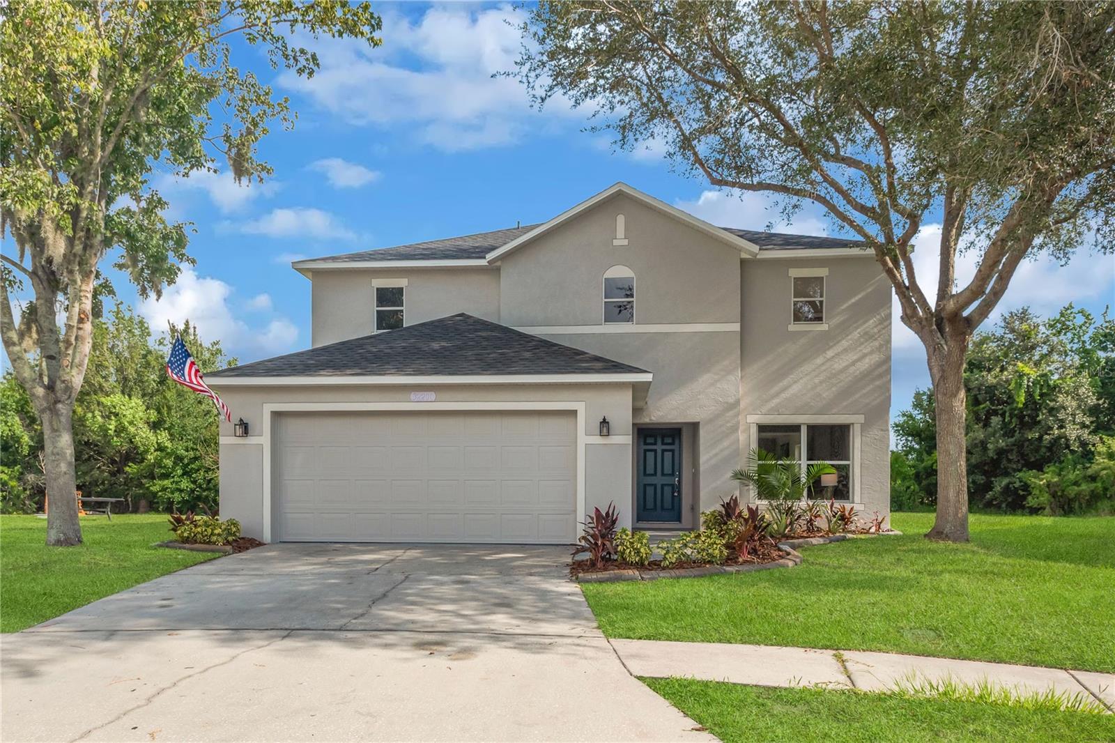 Immaculately maintained and move-in ready, this stunning 3-bedroom, 2.5-bathroom home in the desirable New River Lakes community offers an space, comfort, and style, along with a BRAND NEW ROOF and HVAC in 2025. From the moment you step inside, you'll notice the pride of ownership throughout, with every room showcasing the care and attention that has gone into keeping this home beautiful. Designed with both functionality and entertaining in mind, the open concept floor plan features luxury plank flooring throughout all the living areas. The heart of the home is the beautifully appointed kitchen, complete with granite countertops, solid wood cabinetry, and gorgeous stainless-steel appliances.   Get ready to fall in love with the memories you will make here during holiday dinners and casual evenings alike. The kitchen opens to the main living room, making it ideal for everyday living and entertaining alike.  The oversized family room is the perfect place for relaxing at the end of the day, watching your favorite movie, or enjoying family game night, or create a formal dining room or office.  Tall sliding glass doors lead to a spacious patio, and provide an amazing lake views and tons of natural light. A downstairs half bath offers privacy for both guests and residents. A fantastic feature of this home is the spacious master suite with a SPLIT FLOOR PLAN, offering privacy and convenience away from the secondary bedrooms. This relaxing retreat provides tons of closet space and an amazing en-suite bath.  A large shower, luxurious garden tub, and dual vanities create a peaceful environment for getting ready, or winding down at the end of the day. This incredible master suite is the ultimate owner's sanctuary. Two additional upstairs bedrooms and guest bath mean everyone has plenty of room to spread out. You are going to fall in love with the EXTRA LARGE LOFT upstairs… the perfect space for a media room, game room, office, studio, or second living area designed for your needs. The list goes on and on.  The huge backyard is the perfect spot of enjoy living the Florida lifestyle, grilling with friends, and taking in our beautiful sunsets.  Gorgeous lake and conservation space behind your yard provides a scenic backdrop, and plenty of nature.  New River Lakes offers an exceptional location with convenient access to some of the area's top-rated public, private, charter, and magnet schools, as well as several higher education institutions and everyday conveniences are just minutes away. Residents also enjoy easy access to premier shopping, dining, and entertainment destinations, including Tampa Premium Outlets, The Shops at Wiregrass, and Krate at the Grove. Popular attractions such as B&B Theatres, AdventHealth Center Ice, Main Event, Urban Air Adventure Park, Busch Gardens, and Adventure Island provide endless opportunities for recreation and family fun.Lovingly cared for, and beautifully maintained, this gem is ready for its next owner to move right in and start making memories. Don't miss your opportunity to make this remarkable home yours!
