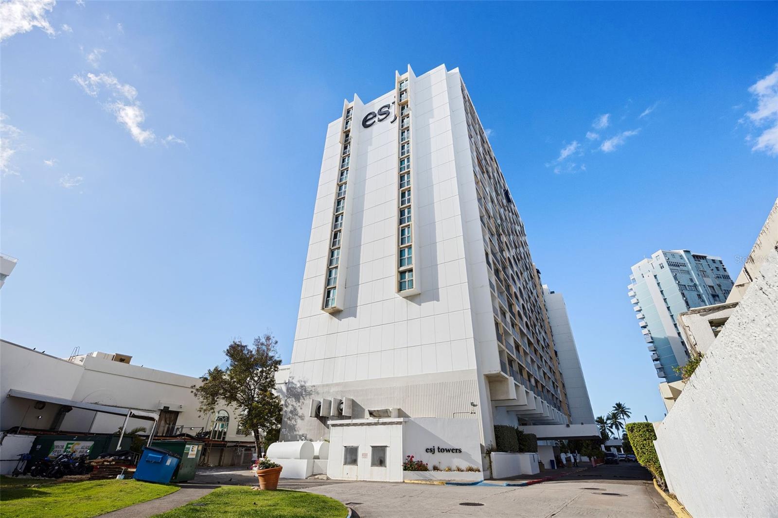 Discover a high performing beachfront investment in the heart of Isla Verde with this oceanfront studio at ESJ Towers, a well established condo hotel offering exceptional flexibility for investors seeking hotel managed income through the ESJ rental program, independent short term rentals, or long term leasing. Located on the third floor within a private wing of the condo hotel and offering approximately 428 square feet, the studio is thoughtfully designed with two full beds, a full bathroom, neutral flooring, and a modern full kitchen featuring neutral color cabinetry, quartz countertops, and stainless steel appliances, complemented by a private ocean view balcony that consistently attracts strong vacation demand. Direct private access to Isla Verde Beach, recognized by USA Today as the number one urban beach, combined with its proximity of less than two minutes to Luis Muñoz Marín International Airport makes this property especially appealing to short term renters and business travelers, supporting solid year round occupancy. Steps away from restaurants, supermarkets, pharmacies, and vibrant nightlife, and adjacent to the iconic Fairmont El San Juan Hotel, the location supports premium nightly rates while remaining just minutes from Mall of San Juan and a short drive to the historic charm of Old San Juan. Guests and residents enjoy resort style amenities including 24 hour security, front desk service, fitness center, lobby bar and lounge, coffee shop, game room, and a swimming pool scheduled for renovation, further enhancing future value. Adding to its investment appeal, the building features a full power generator and water cistern, and the unit includes one deeded covered parking space, delivering reliability, convenience, and long term desirability in one of Puerto Rico’s strongest rental markets.