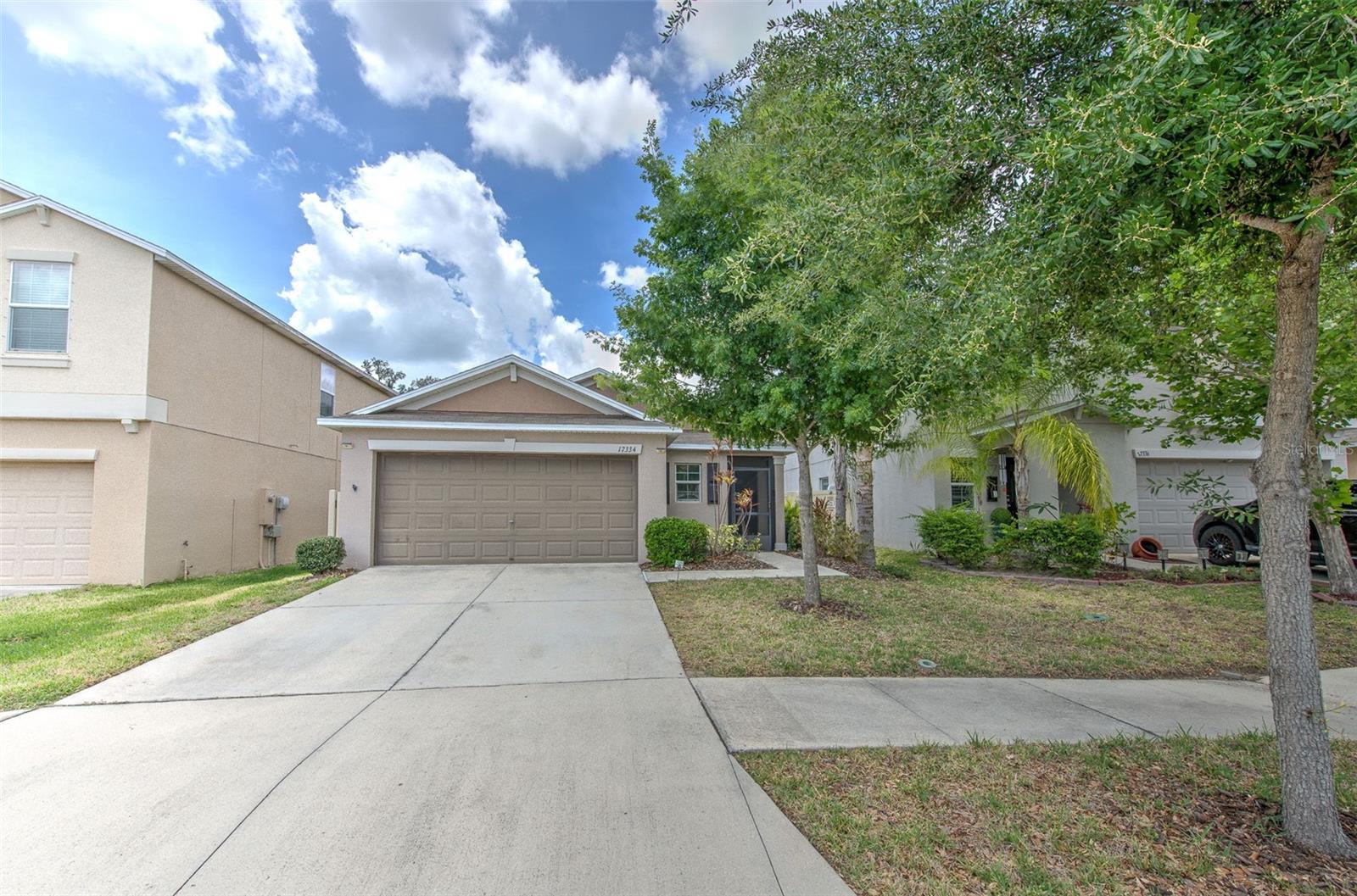 Short Sale. Located in the peaceful community of Vista Palms, this well-maintained 3-bedroom, 2-bathroom home with a 2-car garage offers a comfortable and stylish living experience. The home features an open floor plan with tile flooring throughout the main living spaces, creating a bright, cohesive, and welcoming environment.  The kitchen is both functional and inviting, complete with wood cabinetry, a large pantry, breakfast bar, and all included appliances—perfect for everyday living or entertaining guests. A split-bedroom layout enhances privacy, with the primary suite positioned at the back of the home.  Step outside to enjoy the extended screened-in patio, which overlooks a tranquil conservation area with no rear neighbors—ideal for relaxing or enjoying outdoor time in peace.  Residents of Vista Palms enjoy access to a variety of resort-style amenities, including a community pool with cabanas, splash pad, playground, walking trails, a 24-hour fitness center, and courts for tennis, pickleball, and bocce. Lawn care is included in the low monthly HOA, adding convenience to your lifestyle.  With close proximity to shopping, dining, and major roadways, this home offers both convenience and a quiet setting.  Short sale; price subject to lender approval.