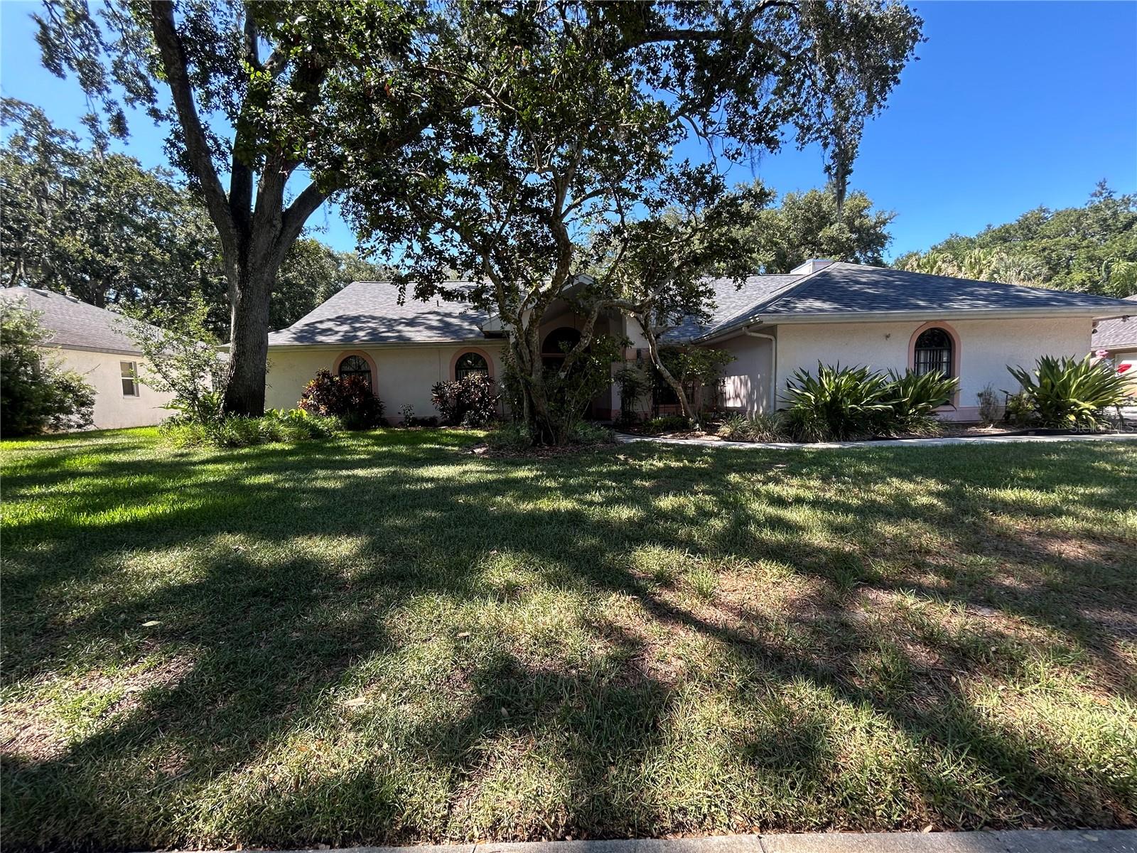 Bring all offers! This spacious 4-Bedroom 2.5 Bath home is tucked away in the neighborhood of Hounds Hollow. A quaint community with custom built homes, mature oak trees and an oversized lot make this property a rare find in the desirable Lutz area. Inside you will find a formal living room and dining room, open generous size kitchen with an island overlooking the family room. This home sits on a beautiful 
.58-acre wooded lot with a screened in pool. This home has a spacious desired layout, ready for you to put your finishing touches to make it your own. New roof 2025, pool pump and saltwater system completed in 2025.