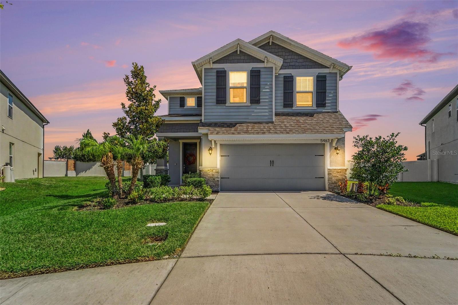 Fantastic water lot home in Avalon Park! This home is energy star certified and the floor plan is comfortable and functional. There is plenty of natural light and a wide-angle view of the backyard through the sliding doors. The kitchen is decked out with stylish granite counters, undermount sink, and 42” white cabinet, oversized island with a built-in breakfast bar. Separate formal areas highlight the first floor as well. The owner’s suite features an impressive walk-in and a spa-inspired bathroom with dual sinks, double vanity with granite counter, garden tub and separate shower. This amazing home is also situated on one of the largest and most scenic in the community. No backyard neighbors here, and there is plenty of room for a private pool, if you’d like to add one. The water view from the rear patio is lovely, too! This gorgeous home is located in the highly sought-after community of Avalon Park West in Wesley Chapel. This community offers two separate amenity centers and even more amenities are coming soon! Currently, residents can enjoy a fitness pool, a resort-style zero entry pool, spa, splash park, playgrounds, clubhouses, grilling and picnic areas, walking trails, dog park, and more! Avalon Park West has already developed a reputation for being a coveted place to live, and this home is the complete package with too many upgrades to list. Close to shopping, restaurants and I-75.