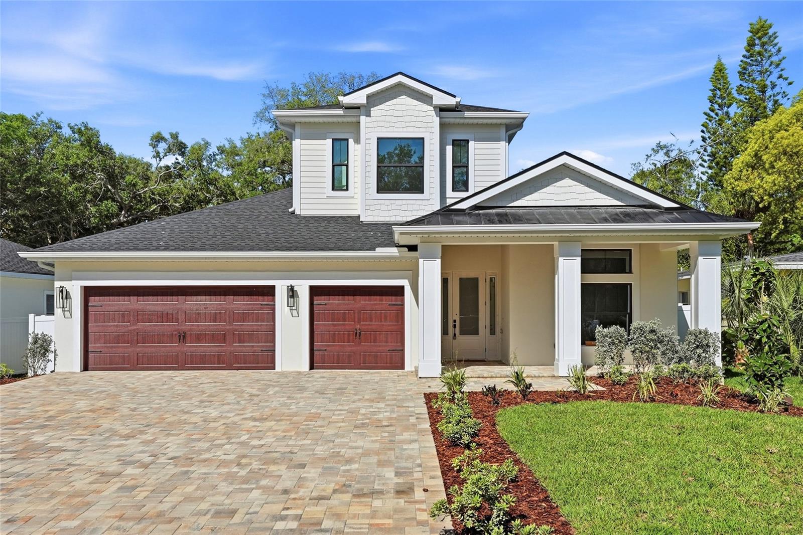 Brand-new Modern Farmhouse steps from the waterfront trails and ancient oak canopy of Philippe Park — Safety Harbor's crown jewel on Tampa Bay. This private residence has direct frontage and views of Philippe Park. This residence is situated on a private dead-end street with no thru traffic, and the 71’ x 154’ homesite (Flood Zone X) offers 3,407 heated square feet and 4,633 total square feet of thoughtfully designed living space.  The first floor features a spacious owner’s suite with custom closets and shelving, separate his-and-hers walk-in closets, and a spa-inspired bath complete with dual vanities, quartz countertops, walk-in shower, and freestanding soaking tub. A guest bedroom with full bath on the main level can also function perfectly as a home office. Designed for both everyday living and entertaining, the home includes a formal dining room and a large great room anchored by a propane gas fireplace with TV feature wall. The chef’s kitchen showcases an oversized island with Taj Mahal quartz countertops, stainless steel appliances, 48" gas range with custom built-in hood, pot filler, two-tone cabinetry, and a walk-in pantry. Luxury vinyl plank flooring runs throughout the main living areas, and impact-rated windows and doors provide both storm protection and energy efficiency. A full walk-in laundry room is also conveniently located on the first floor. Upstairs, bedrooms three and four each offer private en-suite baths and are complemented by a spacious bonus loft or game room. A secondary washer/dryer hookup provides the option for an additional stackable laundry unit. Enjoy Florida living year-round from the covered rear lanai with outdoor kitchen, plus a welcoming 216-square-foot front porch. The backyard is fully enclosed with 6-foot white vinyl privacy fencing. Additional highlights include an oversized 702-square-foot three-car garage with epoxy-finished floors, paver driveway, septic system with county water, and 250 gallon buried propane tank. This home comes with a builder warranty. Philippe Park spans 92 acres of waterfront beauty with a boat ramp, fishing, playgrounds, and scenic walking paths. Located just two miles from downtown Safety Harbor, the marina, pier, and Main Street’s charming shops and restaurants — and less than a five-minute golf cart ride into town — this location offers the perfect blend of privacy, nature, and convenience.  Call to schedule your showing before it’s’ too late!