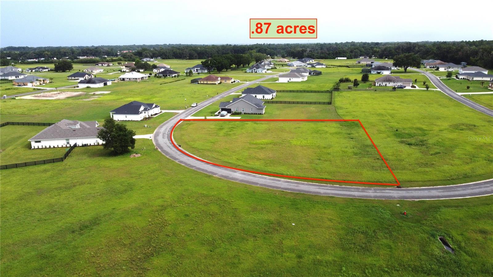 Rare Oversized Corner Lot in the Sought-After Gated & Safe Community of Irish Acres. Nestled on lush land just north of Ocala, this exceptional .87-acre corner lot sits within the prestigious, deed-restricted community of Irish Acres — a private, 300-acre neighborhood that was once a celebrated Thoroughbred breeding & training operation. Pick your own builder.  With an impressive 350 ft of road frontage & a generous 37,800 sq ft of buildable space, this lot offers the size, privacy, & presence that discerning buyers rarely find. Best of all, the lot faces a beautifully preserved open area of the community. Irish Acres is more than a place to build... It's a lifestyle. 

Enjoy the peace of gated, county living with paved, lighted streets featuring Miami curbing, underground utilities, and 2 park areas. With easy access to I-75 and just minutes from Ocala's city limits, you're perfectly positioned for the shopping, dining, medical care, and entertainment options of both Ocala and Gainesville — without sacrificing a single breath of fresh country air. Choose any builder you desire, meet the community's 2,000 sq ft minimum, and start building the home and life you've always imagined. MAKE AN OFFER NOW!