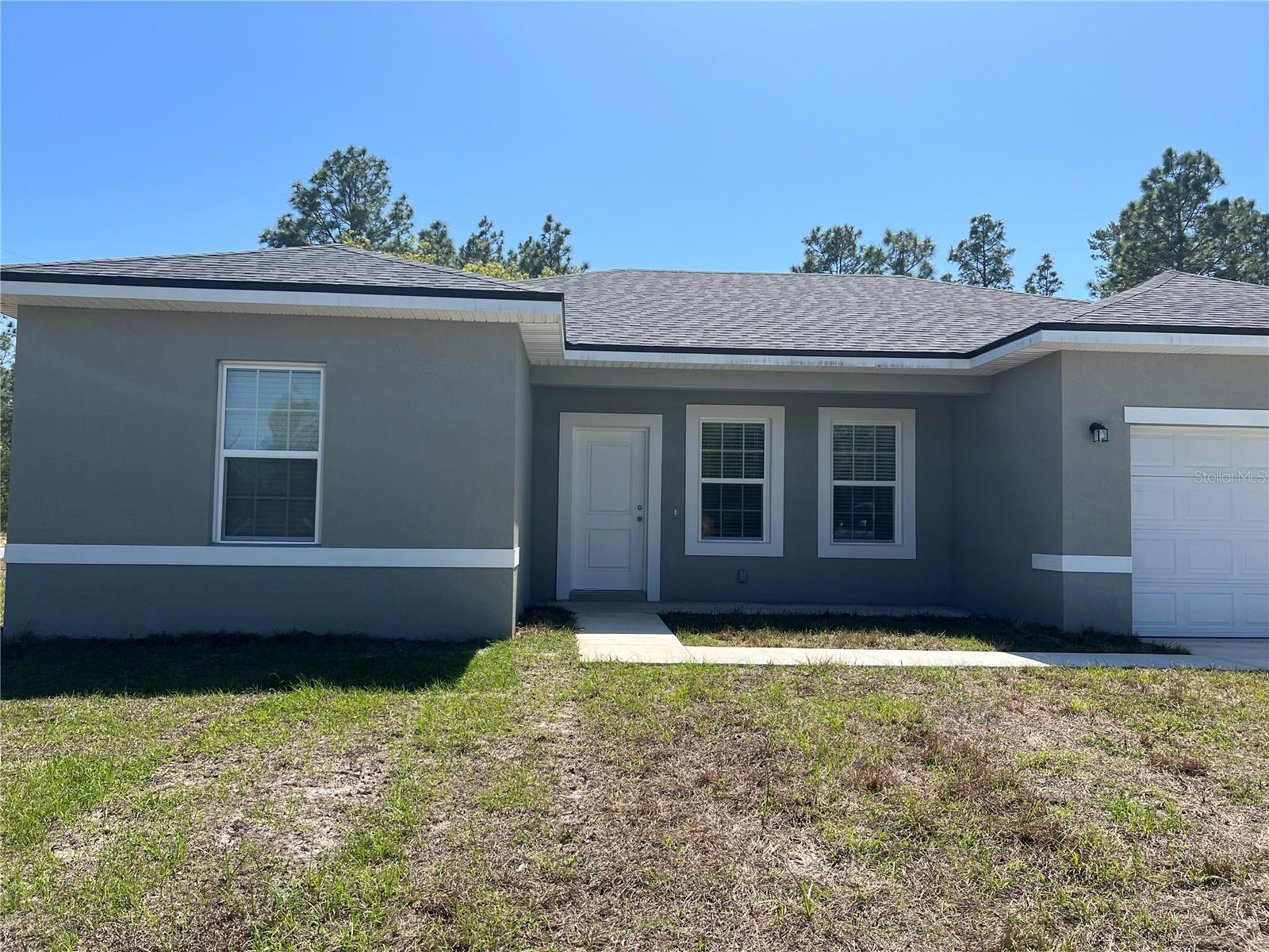 Beautiful 4BR/2BA  in Marion Oaks North! Features an open concept floor plan, kitchen with granite countertops, soft close cabinets and stainless steel appliances, tile throughout, granite counter tops in the bathrooms as well!! This one won't last long, contact us today!