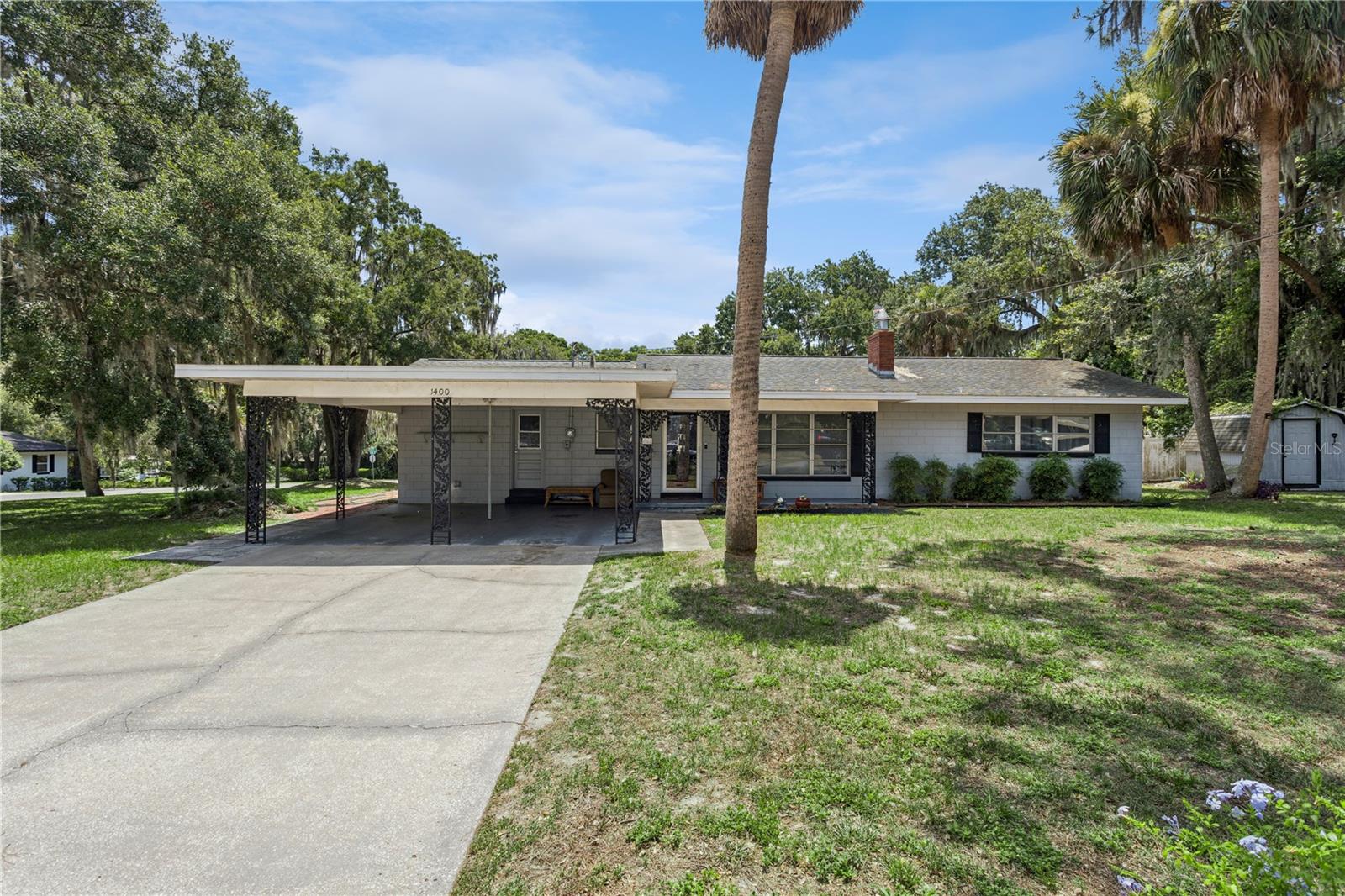Check out this adorable home in the heart of the Love's Point community! This home is situated on a large corner lot in one of Leesburg's most established lakefront communities. This home features 3 bedrooms, 2 bathrooms, a spacious living room and a kitchen/dinette combo! The large, covered carport adds functionality and charm to the front of this attractive home! This neighborhood is known for its quiet streets and close proximity to all that Leesburg and the Chain of Lakes has to offer - boating, fishing, and all the activities on Main Street. There is no HOA and property taxes are low!!