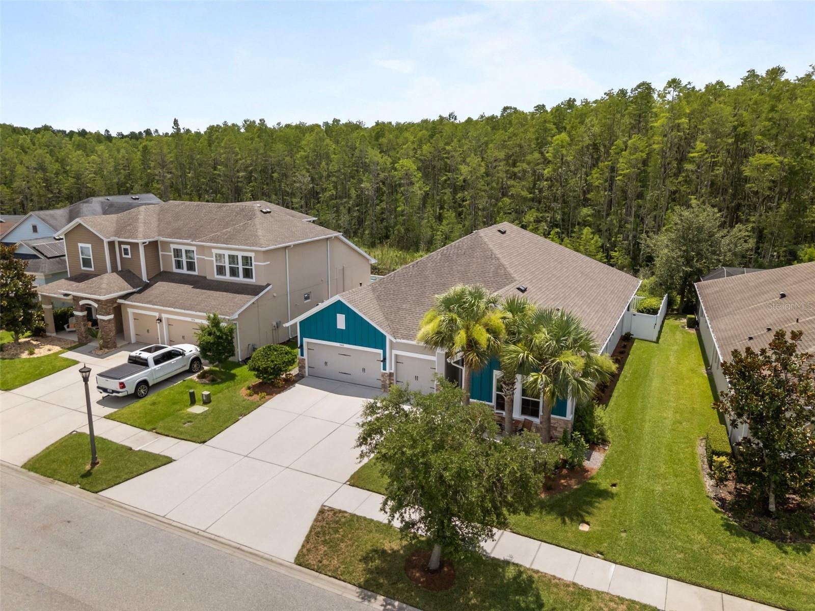 Located on a 65-foot-wide conservation lot along a quiet street with no through traffic, this David Weekley home features a dedicated office, true three-car garage, hardwood floors, gourmet kitchen, fenced backyard, covered lanai, expansive paver patio, and room for a future pool with a pool bath already in place. Wooded conservation views, professional landscaping, and a Florida-native butterfly garden create a private outdoor setting designed for relaxing and entertaining.

A welcoming front seating area offers the perfect spot for morning coffee. Inside, the open foyer and thoughtful layout make a warm first impression, with hardwood flooring extending throughout the main living areas and bedrooms. The dedicated study provides flexible space for a home office, playroom, or additional living area.

At the heart of the home, the gourmet kitchen features a 9-foot quartz island, reclaimed Colorado barnwood accent, white cabinetry with soft-close drawers, five-burner gas cooktop, built-in wall oven and microwave, tile backsplash, and a walk-in climate-controlled pantry. The kitchen opens to the spacious family room, where a four-panel sliding glass door frames the conservation views and creates a seamless connection to the outdoor living space. The adjoining dining area is highlighted by an 11-foot tray ceiling.

The four-bedroom, three-bath layout offers excellent privacy. The primary suite features an 11-foot tray ceiling with reclaimed Colorado barnwood, conservation views, dual sinks, an oversized walk-in shower, and a generous walk-in closet. Two secondary bedrooms share a full hall bathroom with dual sinks and a tub-shower combination, while a separate guest bedroom is located near another full bathroom.

Additional features include crown molding, surround-sound prewiring, a water softener, generous storage above the garage, and energy-efficient construction. A new heat pump and air handler installed in November 2024 include transferable warranties.

Located in Asturia, residents enjoy resort-style amenities within walking distance, including a clubhouse, fitness center, community pool, dog park, playground, and miles of scenic trails. The community also offers convenient access to the Suncoast Parkway, shopping and dining along State Road 54, and highly rated schools.

Qualified and eligible buyers may also have the rare opportunity to assume the seller’s 2.25% VA loan, subject to lender and VA approval, buyer qualification, and the buyer’s ability to cover the difference between the purchase price and assumable loan balance.