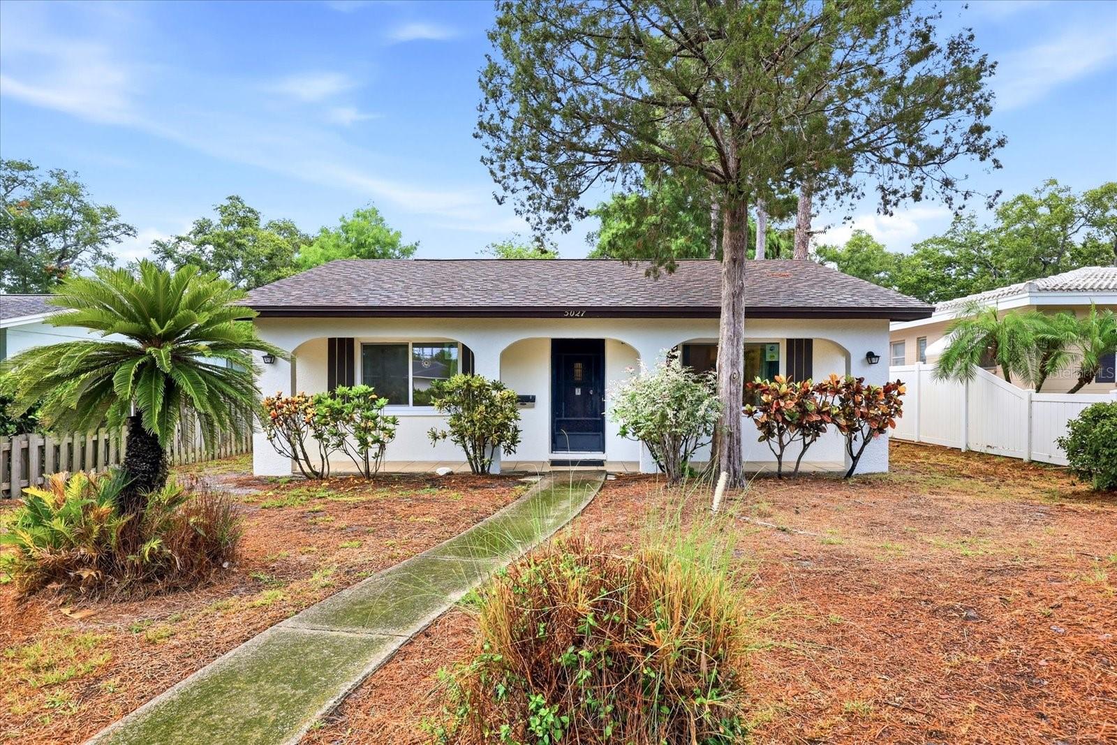 Pride of ownership shines throughout this well-maintained, original-owner home in the heart of central St. Petersburg. Major updates provide peace of mind, including a new roof (2024) and A/C system (June 2023). The home features easy-care tile flooring throughout, some updated windows (2022), fresh interior and exterior paint, and new switches, outlets, and recessed lighting. The irrigation system is supplied by a well and operates on a timer, to help reduce water costs. Convenient paved alley access leads to the one-car garage, along with a two-car carport and an additional parking pad that offers plenty of space for extra vehicles, a boat, or recreational equipment. Ideally located near downtown St. Petersburg, shopping, dining, parks, and Gulf beaches, this move-in-ready home is ready for its next owner.