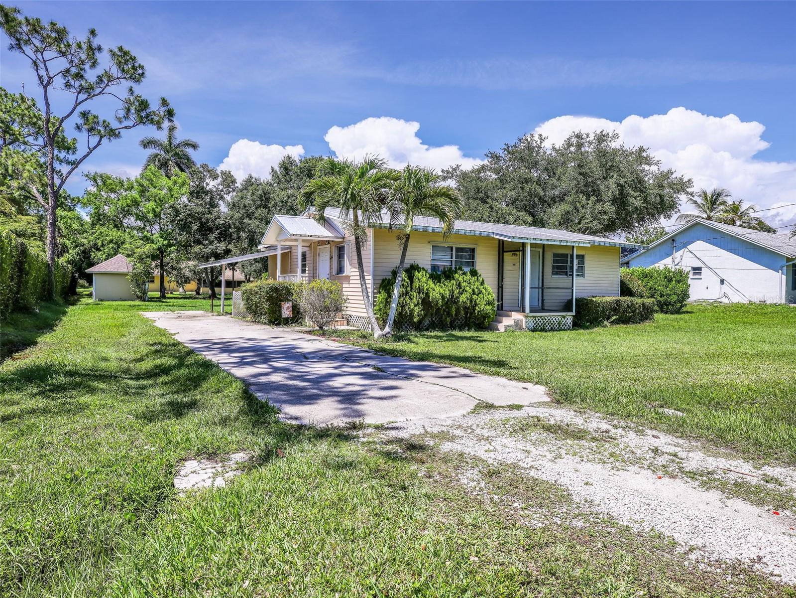 Welcome to this beautiful, meticulously kept 3-bedroom, 2-bathroom home in Naples. Situated on an oversized 16,117 SQFT lot, this property offers plenty of outdoor space and privacy. The home features a durable metal roof installed in 2018, updated electrical completed in 2014, and a newer central A/C system approximately 5 years old. Inside, you'll find a beautifully renovated kitchen with granite countertops, a center island, updated cabinetry, a new stainless steel refrigerator, a new dishwasher, and a functional black enamel stove. New LVP flooring and crown molding run throughout the home, creating a clean and modern feel. Additional upgrades include a water heater approximately 1 year old and a washer and dryer that are only 6 months old. Outside, a professionally built shed with its own sloped roof provides excellent storage or workspace. PLEASE NOTE - I am not available on the Sabbath/saturdays PLEASE CONTACT 2ND AGENT ON THE LISTING (NICOLE)