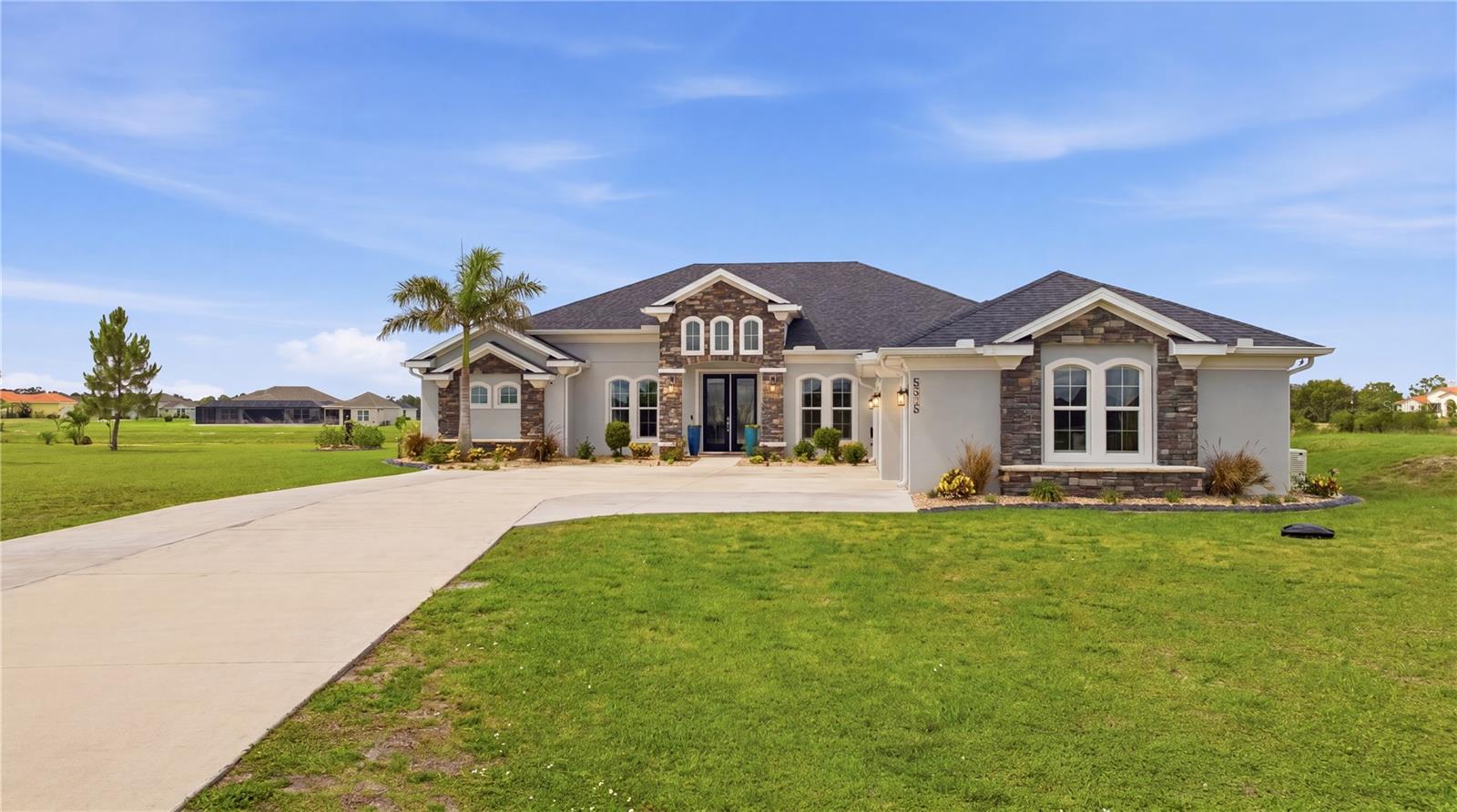 Set against nearly an acre of pristine waterfront in the exclusive gated community of Lake Toscana, this exceptional 2021-built Montalto model offers the perfect blend of luxury, privacy, and smart modern upgrades. Situated on .94 acres with an impressive 287 feet of southern-facing water frontage, this meticulously maintained home delivers over 3,055 square feet of thoughtfully designed living space, complete with a screened saltwater pool and countless high-end improvements. A long 200-foot extended driveway welcomes you home, leading to stunning custom double glass front doors that make an unforgettable first impression. Inside, you’ll find soaring tray ceilings, crown molding, porcelain tile throughout, hurricane-impact windows, and an open-concept floorplan designed for both everyday living and effortless entertaining. At the center of the home is a chef-inspired kitchen featuring dual oversized islands, Quantum quartz countertops, solid maple cabinetry with pull-outs, under-cabinet lighting, glass and natural stone backsplash, coffee bar, walk-in pantry, wall oven and microwave, and a newly installed 5-burner gas cooktop (2025). The spacious great room flows seamlessly to the outdoor living space through expansive sliding glass doors, creating the ideal indoor-outdoor lifestyle. The split-bedroom layout provides privacy for all, with a luxurious owner’s suite featuring tray ceilings, oversized windows overlooking the water, a spa-inspired bathroom with soaking tub, dual vanities, an open walk-in shower, water closet, linen storage, and an oversized walk-in closet. Additional flex spaces include a private office and media room, offering versatility for work, relaxation, or entertaining. Step outside into your private backyard retreat where the screened saltwater pool overlooks peaceful water views. The pool enclosure was fully rescreened in 2025 with upgraded material, and the back patio was extended with pavers to create an even larger entertainment space. Additional exterior enhancements include professionally sealed pavers with new polymeric sand (2025), new concrete curbing and decorative landscaping rock (2025), underground gutter drainage, and premium Volt landscape lighting. This home is packed with valuable upgrades and major improvements, including: • New architectural shingle roof (2025)• Paid-off solar panel system installed in 2025 with electric bills averaging only $14/month • Professional exterior painting completed March 2025 using Sherwin-Williams Loxon XP paint• New septic tank pump (2025)• New lift station pump (2025)• Extended driveway for additional parking• Custom CHI foam-insulated garage doors with tinted glass inserts• Polyaspartic-coated garage floors• New Samsung Bespoke glass-front refrigerator (2025)• Additional LP gas hookup for future outdoor kitchen, firepit, or grill• Micro-Air EasyStart Flex A/C soft starter for improved HVAC efficiency and smoother startup performance• Additional premium features include a 24kW Generac generator, Carrier 15 SEER HVAC, foam attic insulation, whole-home water softener system, reverse osmosis system, and Pentair pool automation. With nearly every major improvement already completed, this home offers peace of mind, energy efficiency, and luxury living at its finest. Tucked away in one of Tampa Bay’s most unique conservation communities, yet conveniently located near shopping, dining, top-rated schools, and easy access to Tampa, St. Pete, and Sarasota.
