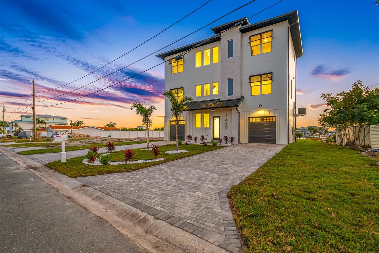 Under contract-accepting backup offers. **Builder will update the outdoor living with stairs from the balcony if buyer requests!** Waterfront Beauty in Isle of Palms. Brand new construction ready for her new owner. This home offers exceptional value based on price per square foot. Priced well under appraisal and under market value. This is a spacious 6 bedroom, 5 full bath, and 1 half bath floor plan designed to accommodate hosting friends and family while ensuring everyone has their own sanctuary. Complete with an elevator, theater room, home office, HUGE chef's kitchen, and views from every corner of the home. The primary suite is a retreat in itself, featuring a spa-like ensuite and expansive closet space with tranquil water-facing views. The exterior presents a clean, modern aesthetic with durable, low-maintenance materials. Marble surrounds the saltwater pool- complete with a heating and cooling feature! This location offers easy access to boating, sunset west facing views, and a quiet canal. This home is a true sanctuary but built like a fortress. All block construction on a 3-tier foundation with hurricane rated windows and doors and a metal roof.