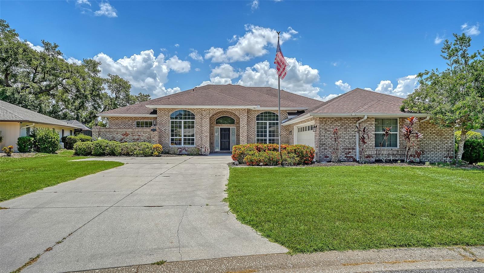 Bent Tree Village-custom brick home on the 2nd fairway with exceptional curb appeal and located on a quiet street. Luxury vinyl plank flooring enhances the main living spaces, while the bedrooms feature hardwood flooring. The updated primary bath has dual sinks, a separate toilet area, and a walk-in shower with dual showerheads. Overall sq footage is 3,836, including a 2.5-side-entry car garage with a separate golf cart door and a large lanai with oversized pool. This spacious residence offers 3 en-suite bedrooms plus a den that can easily serve as a 4th bedroom, office, or flex space. Remodeled kitchen with stainless steel appliances opens to a bright Great room with volume ceilings, crown moldings, built-in bar area, and sliding doors to outdoor living for entertaining & enjoying the view of the fairway.  Plantation shutters in the den/4th BR & dining area enhance the beauty of this bright, airy home. Well-maintained and move-in ready. Close to the clubhouse, where golf course memberships are optional, this is a great place to call home. Close to shopping, churches, restaurants,  Dr's Hospital, and a short distance to world-famous Siesta Key Beach. Come Live the Lifestyle!