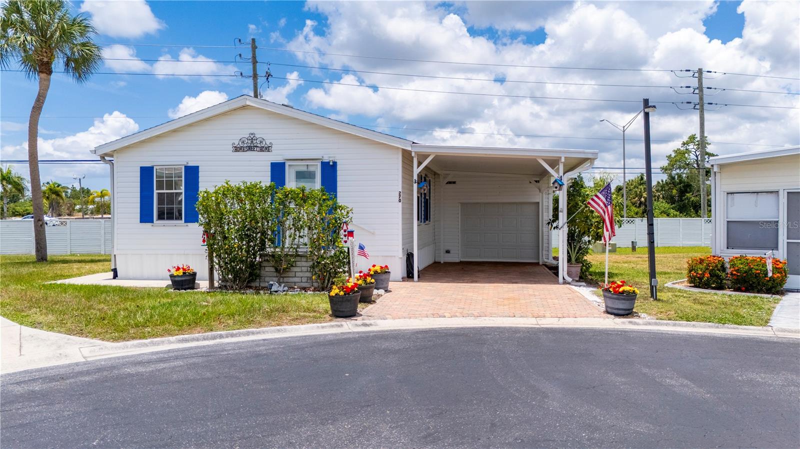 Enjoy the Florida lifestyle in this beautifully updated 2-bedroom, 2-bath home located in a sought-after 55+ resident-owned co-op manufactured home community. Offering a spacious and inviting floor plan, this home features a large primary suite, an expansive living room, and a generously sized eat-in kitchen that's perfect for entertaining family and friends. Recent improvements include luxury vinyl flooring throughout, new kitchen countertops and sink, a new HVAC system installed in 2024, a new roof in 2022, and a water heater installed in March 2021. The HVAC system has been professionally serviced annually for added peace of mind. An oversized garage with an attached workshop provides plenty of room for storage, hobbies, or projects, while the attractive paver driveway enhances the home's curb appeal. The low HOA fee of just $320 per month includes water, sewer, cable, internet, lawn care, an on-site manager and office staff, a heated pool, dog park, fishing, recreational facilities, and much more. Ideally located near shopping, restaurants, medical facilities, and some of Southwest Florida's premier golf courses, this move-in-ready home offers the perfect blend of comfort, value, and an active lifestyle. Don't miss this opportunity to own a home in one of the area's most desirable resident-owned communities.
