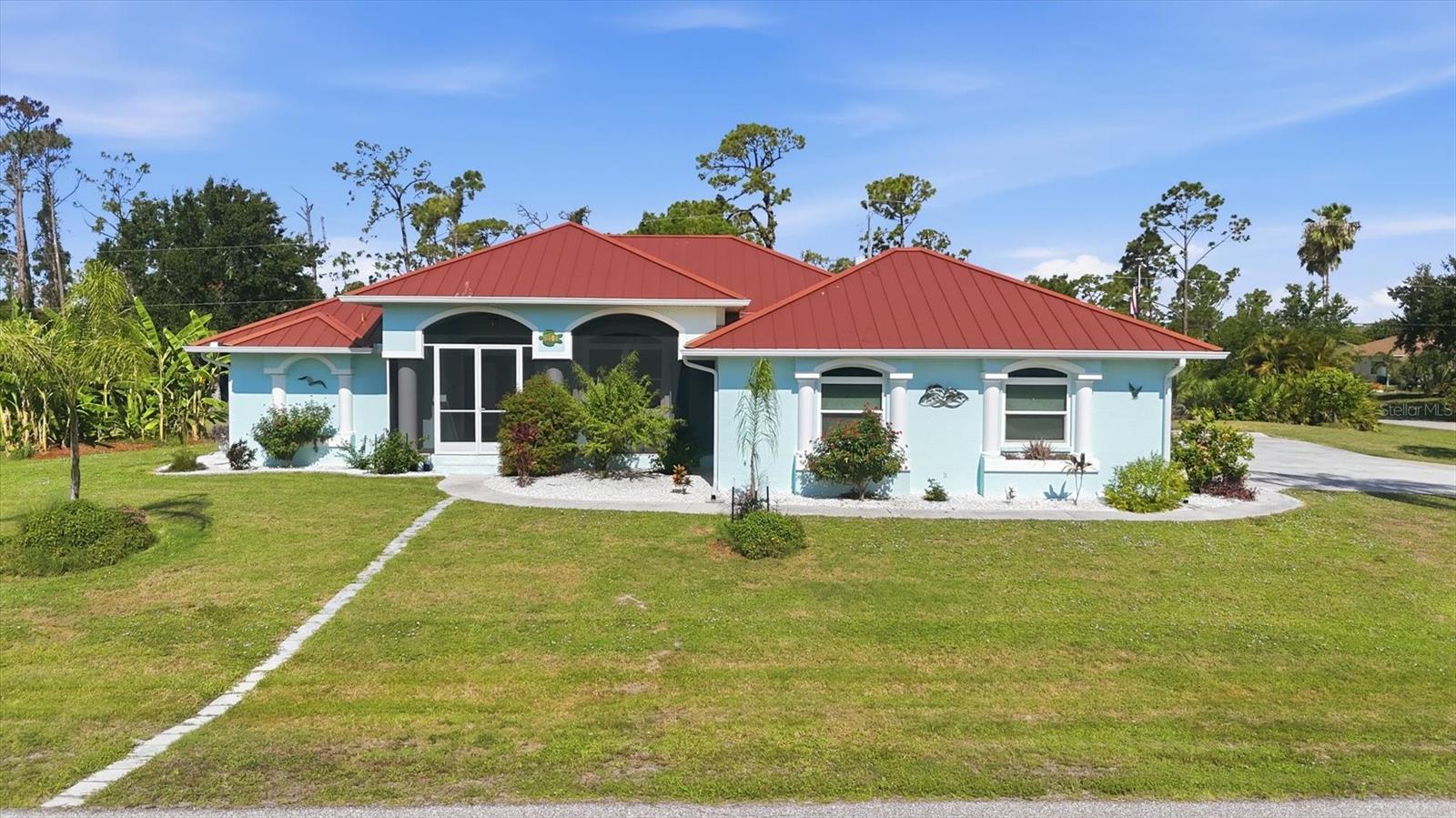 Rarely does an opportunity like this come along! Situated on an incredible seven lots totaling approximately 1.6 acres, this beautifully updated 3-bedroom, 2.5-bath pool home in Gulf Cove offers the perfect blend of privacy, luxury, and Florida lifestyle living. Located just two blocks from the community boat ramp, you'll enjoy direct access to Charlotte Harbor and the Gulf of America for only $75 annually, making this a dream property for boating and fishing enthusiasts.  

Inside, the home is filled with natural light streaming through impact windows and pocket sliding glass doors, highlighting the luxury vinyl flooring, soaring vaulted ceilings, and stylish updated lighting throughout. The spacious split-bedroom floor plan provides privacy for family and guests, while a dedicated den with built-in shelving creates the perfect home office or flex space. The owner's suite is a true retreat featuring elegant tray ceilings, private lanai access, a large walk-in closet, and an updated ensuite bath with dual vanities and a walk-in tiled shower.

The chef-inspired kitchen is designed to impress with two oversized islands offering abundant storage, quartz countertops and matching backsplash, a pot filler above the induction stove, convection oven and convection microwave, built-in Keurig refrigerator feature, two spice cabinets, and two appliance lifts conveniently integrated into the cabinetry.

Outdoor living takes center stage with the expanded lanai, completed in 2023, creating an exceptional entertaining space around the heated and chilled saltwater pool. Additional outdoor features include an outdoor shower, storage shed, screened garden shed, and an impressive collection of mature fruit trees including mango, grapefruit, fig, banana, pomelo, lemon, avocado, and starfruit.

Peace of mind comes with numerous upgrades including a 2022 metal roof, hurricane shutters, impact windows, a 2022 septic system, a 200-amp electrical panel wired for generator connection, and an oversized two-car garage with a newer retractable door screen.

Conveniently located near shopping, dining, golf courses, world-class fishing, and the beautiful beaches of Boca Grande and Manasota Key, this exceptional Gulf Cove property offers the space, upgrades, and waterfront lifestyle with no HOA and no deed restrictons you've been searching for.