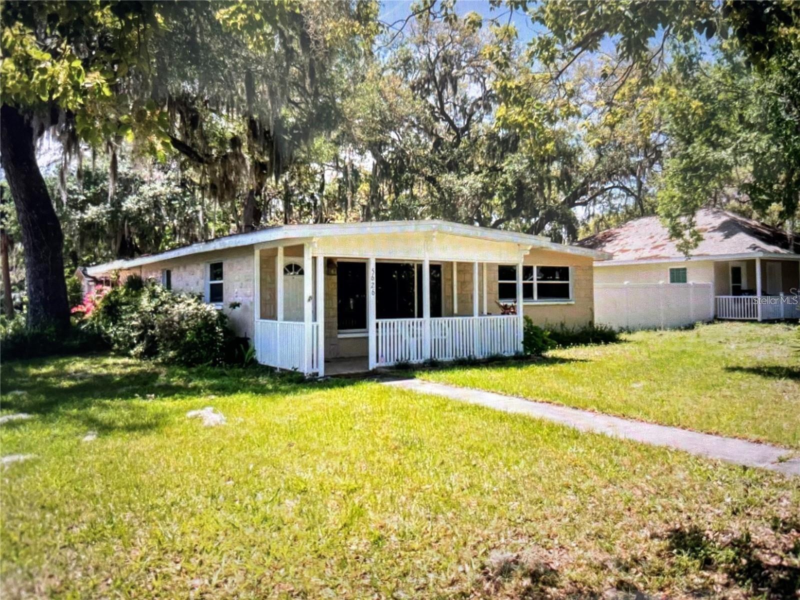 Located near beautiful downtown New Port Richey! 3 bedroom, 2 bath, sitting on a quarter of an acre corner lot! 3 minute walk to all the restaurants, bars, park, theater and shops. Tile and wood floors throughout. Enjoy your coffee on the front porch admiring the gorgeous mature trees that line the streets and a large shaded yard. Spacious shed located in the back yard offers plenty of storage, washer and dryer included.