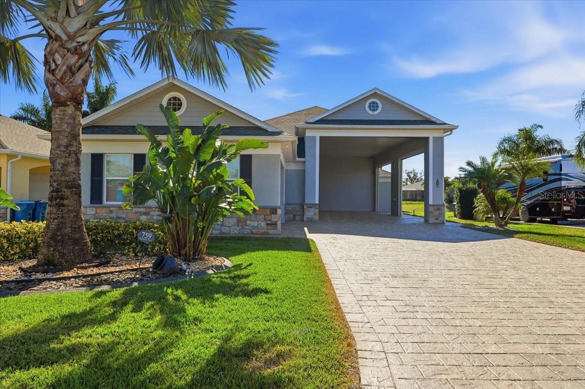 MOTIVATED SELLER
Wake up to serene pond views every morning in this stunning, move-in-ready retreat.  This home located in the sought after community of Mt. Olive Shores North has it all.  Starting with the outside, the view of the pond from the lanai is beautiful.  The lanai has a outdoor grill with mini fridge and is adjacent to the second bedroom suite.  This room has another beautiful view of the pond with it's own private bath and walk in closet for privacy.  
The open-concept living area is bathed in natural light, leading your eyes directly to the breathtaking pond views just beyond your backyard.  The living room has an updated Sono audio system with built in speakers for quality listening.  Speakers outside in the lanai also can be controlled by the inside system.  The kitchen has granite counter tops, a nice size pantry and a desk area.  The flex space makes a perfect office or an additional bedroom if needed.  The spacious primary bedroom leads to a large primary bath. Other features include a 50'x17' RV port with electric shades, newly sealed pavers, central vacuum and custom closets.
Call today to see this home while it lasts.