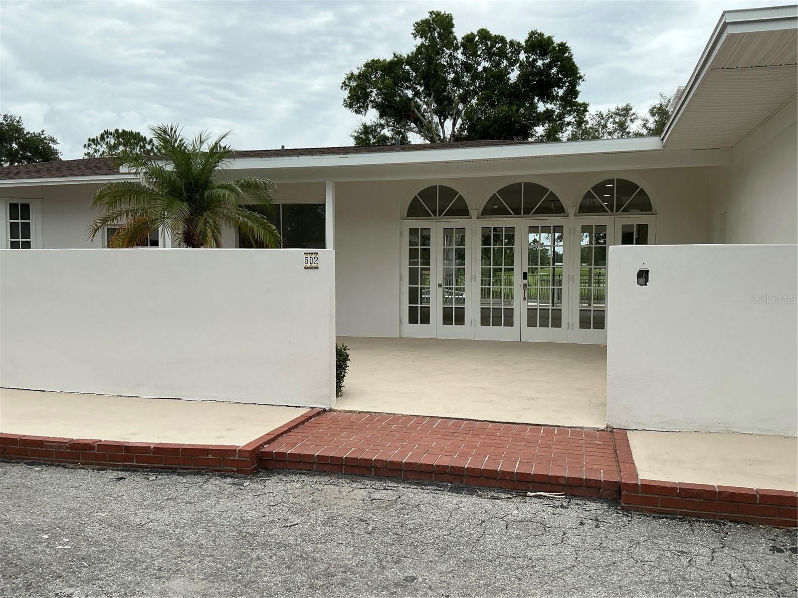 Modern Luxury Meets Golf Course Living at Sara Bay on a 0.73 acre secluded lot.
Welcome to a masterpiece of modern luxury at 502 Magellan Drive, perfectly positioned on one of the premier homesites of the historic Sara Bay Golf Course. This classic concrete-block residence has been completely transformed into a sleek, contemporary palace featuring high ceilings and expansive windows that flood the home with natural light. The open-concept design flows seamlessly into a massive master retreat complete with an elegant sitting area and golf course vistas. On cooler evenings, cozy up by the living room's chic wood-burning fireplace. Step through the sliding doors to find your private paradise: an extraordinary 80-foot covered back porch, perfect for seamless indoor-outdoor hosting. This grand veranda looks out over a pristine fenced pool, a dedicated fenced dog run, and panoramic, unobstructed fairways. With three bedrooms plus a flexible office/den, this home is complete with a two-car garage and a dedicated golf cart spot. With no rental restrictions this property is an excellent choice for investors wishing to Air BnB or VRBO. Beyond the fairways, enjoy unparalleled coastal convenience. You are located just 10 minutes from the vibrant dining, shopping, and cultural arts of Downtown Sarasota, and less than 20 minutes from the world-famous quartz sands of Lido Key and Siesta Key beaches. Enjoy ultimate freedom with no HOA fees in one of Sarasota's most coveted locations. 5 minutes' drive to SRQ airport is of great convenience.