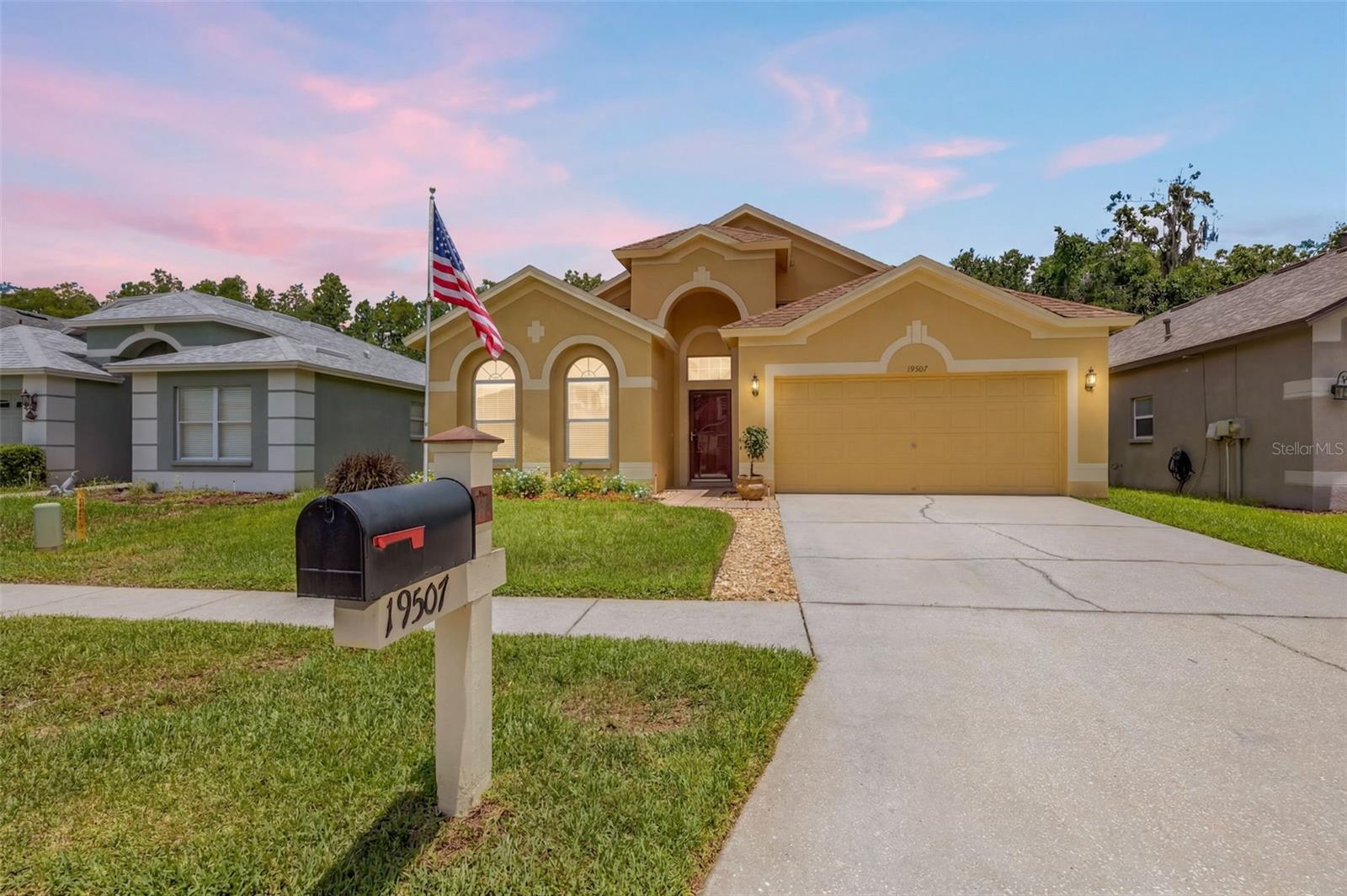 This beautifully maintained single-story home offers a comfortable lifestyle complemented by peaceful conservation views from the backyard. This 4-bedroom, 2-bath home offers 2,060 square feet of a highly functional split floor plan in the sought-after gated community of Oakstead. 
Step inside to experience the sense of space created by high ceilings throughout the home, enhancing the open and airy atmosphere. The heart of the home is a spacious kitchen featuring stainless steel appliances and a charming breakfast nook—perfect for casual mornings. The kitchen flows seamlessly into the main living areas, making it ideal for both everyday living and entertaining.Enjoy the convenience of the private laundry room which includes both washer and dryer. Recent updates include luxury vinyl plank flooring throughout and fresh interior paint, creating a modern and inviting feel. For added peace of mind, the roof was replaced in 2020. The living and dining room combination provides an excellent space for hosting family and friends. Step outside to the extended paved screened lanai, where you can relax and enjoy peaceful conservation views with no rear neighbors. The private backyard offers the perfect setting for morning coffee or evening gatherings. The home's curb appeal is enhanced by a beautifully manicured lawn, supported by an irrigation system servicing both the front and rear yards, helping keep the landscaping lush and attractive year-round. Located in a highly rated school district, this home offers easy access to shopping, dining, parks, and major commuter routes. Combining privacy, convenience, and exceptional value, this home is truly move-in ready. Schedule your private showing today!