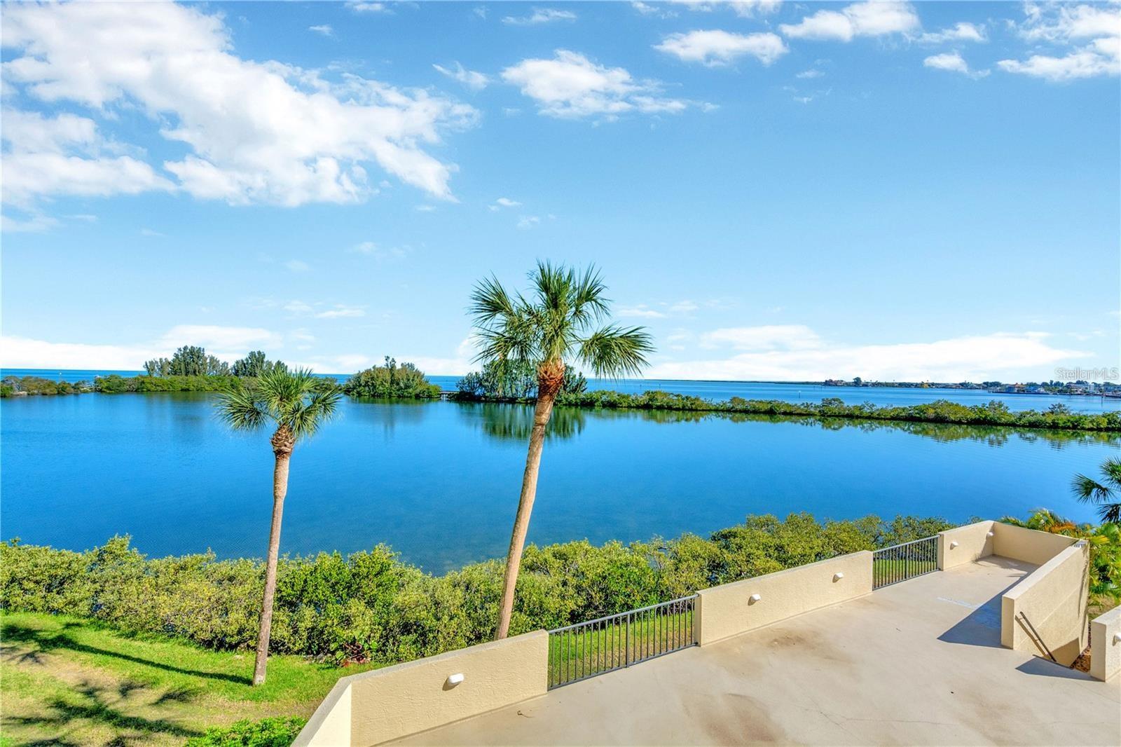 ESCAPE TO SUNNY FLORIDA where every day feels like a “vacation day” and enjoy the tranquility of your own piece of Paradise in this beautiful 5th floor condo that meshes the calming interior décor to the beauty of a coastal oasis. And the VIEW ~~Experience sparkling waterfront views as sunlight bounces off the Lagoon and Gulf of America waters and brilliant watercolor sunsets that will take your breath away.  Enjoy all of this from your private covered Balcony.   You may even catch a glimpse of manatee and dolphin frolicking below you.  This open floor plan allows furniture placement flexibility to meet your specific needs. Enjoy plenty of space for a dining room table to entertain family and friends; amazing living room area to relax and gaze at beautiful Gulf waters from your floor to ceiling sliders. Beautiful contemporary kitchen includes abundance of cabinets, plenty of elegant granite countertop space, coordinating accent backspash and stainless steel appliances make this condo ready for you to move in and enjoy entertaining with ease. Easy care flooring, on trend lighting fixtures/fans give this unit a contemporary flair. Spacious primary Bedroom also has floor to ceiling sliders so you are never without a water view.  Unit has Hurricane impact sliders. FURNITURE and decorative FURNISHINGS included for your convenience; all you have to do is bring yourself and start enjoying that coastal lifestyle. Designated parking space under building is included with this unit.  Gulf Island Beach & Tennis is a wonderful resort style community offering a private sandy beach, beautiful Olympic style temperature controlled pool with expansive deck for sunbathing overlooking the picturesque Lagoon and nature trail as your backdrop. Mingle with your fellow owners at clubhouse social events put on by the Social Committee in a grand space with dance floor. Other amenities include fitness center, game room, tennis & pickle ball courts. This is a guard gated community with a property manager on-site. Condo fee includes everything except electricity. Within minutes of this waterfront community, are local "beach style" restaurants and casual tiki bars that you can visit by boat or your personal golf cart. Partake in the golf cart parades with your neighbors, which makes it even more fun! Just around the corner, you will enjoy Hudson Beach, SunWest Beach Park, 3 local marinas, public boat ramp, renown Weeki Wachee Springs State Park, Freedom Boat Club, golf courses, shopping, and a myriad of restaurants. Hospital and medical centers are also nearby. I-75 and Suncoast Veterans Parkway make it a convenient drive to Tampa and St Pete/Clearwater Airports including all the Professional Sports and Special Events entertainment venues that St. Pete and Tampa Bay are so proud of.  Whether you are purchasing as your primary residence, a vacation or retirement dream home, or even as a rental investment you will not be disappointed. State mandated Milestone Inspections completed and passed. Don’t miss out ~~ Paradise is calling. Come Live the ISLAND LIFE!!