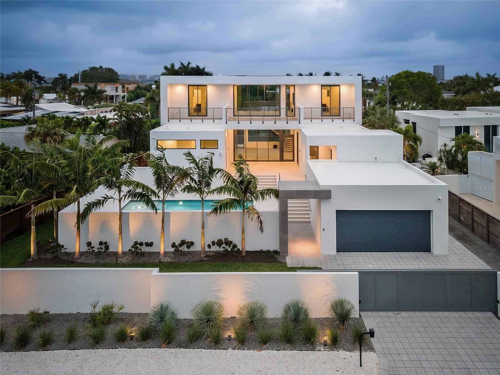 Looking for a new construction home that did not take on flooding during either Hurricane? This modern residence epitomizes luxury living in one of Sarasota’s most coveted coastal neighborhoods, Lido Shores. With a harmonious blend of sleek design and built to or above all current hurricane codes, this home offers an unparalleled lifestyle just steps from your private access to the Gulf of Mexico.

Spanning almost 4,000 square feet, this exquisite property features 4 spacious bedrooms and 5 beautifully appointed bathrooms, ensuring ample space and privacy for both residents and guests. The open-concept living areas are bathed in natural light, showcasing the finest in contemporary finishes and architectural details.

Every inch of this home has been thoughtfully designed for those who desire the pinnacle of modern luxury. The homeowner added numerous custom upgrades throughout construction, with state-of-the-art amenities designed for ultimate comfort and convenience. High-end Thermador appliances anchor the gourmet kitchen, while electric Toto Washlet toilets add a touch of luxury to the bathrooms. Customized closets provide ample storage, and smart home technology is seamlessly integrated throughout, including automated shades, built-in speakers, high-definition televisions, and strategically placed wireless access points.

The property also features a generator for added peace of mind and is pre-wired for solar panels, offering an eco-friendly energy solution.

Step outside to discover your private oasis. The courtyard pool, surrounded by lush landscaping, creates a serene environment perfect for relaxation or entertaining. The rooftop terrace offers panoramic views of the Gulf and downtown Sarasota, providing an idyllic setting for sunset gatherings or quiet reflection. Adding to the allure is the home’s private beach access, allowing you to enjoy the pristine sands and crystal-clear waters of Lido Key whenever you desire.

This property, built by Seaward Homes, truly embodies the essence of luxury coastal living, where every detail has been meticulously crafted to deliver the ultimate in comfort, style, and sustainability. For $1,378/sf it could not be replicated at this price in today's market. Schedule a showing today! Staging is virtual.